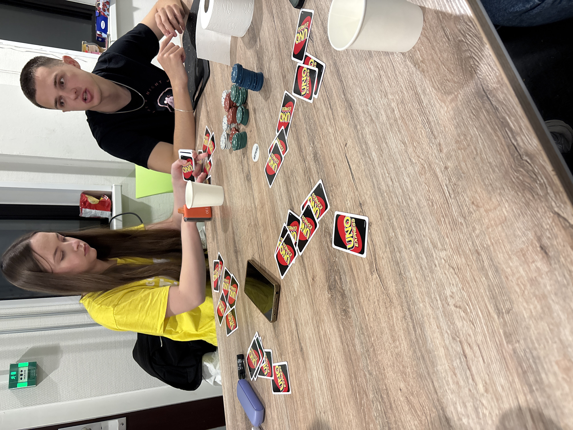 Young adults play UNO card game in Enschede