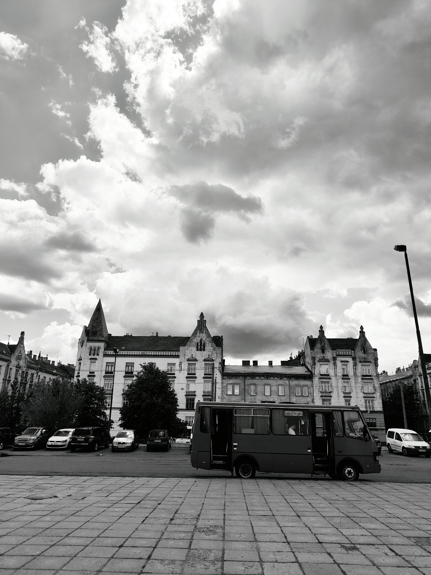 Lviv streets and landmarks under a stormy July sky