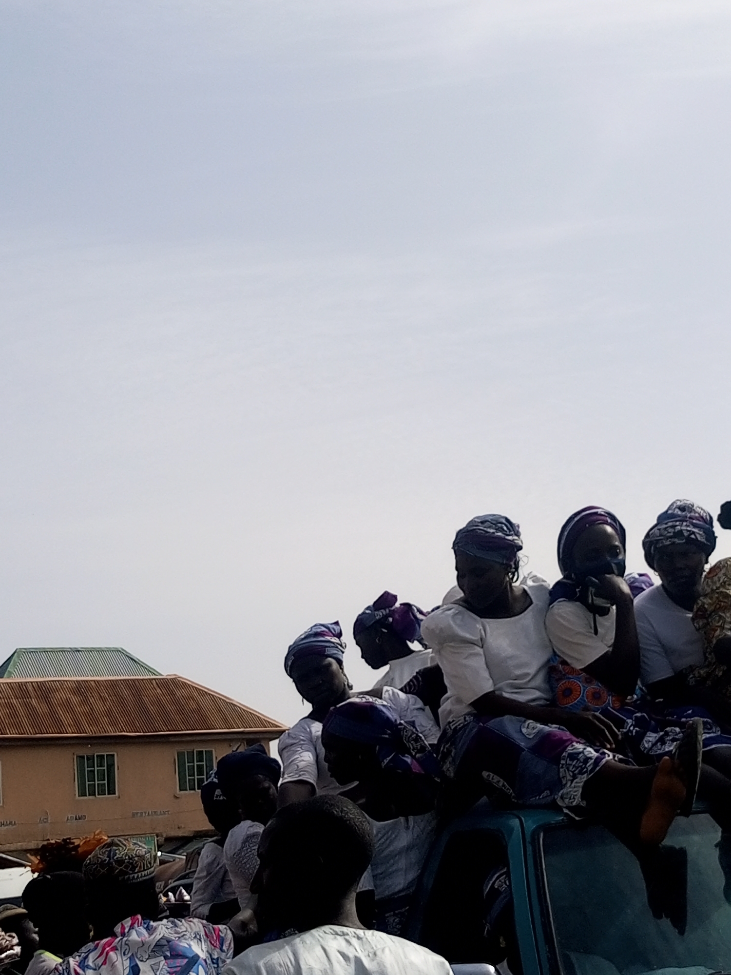 Busy marketplace activity around gas station in Gombe, Nigeria