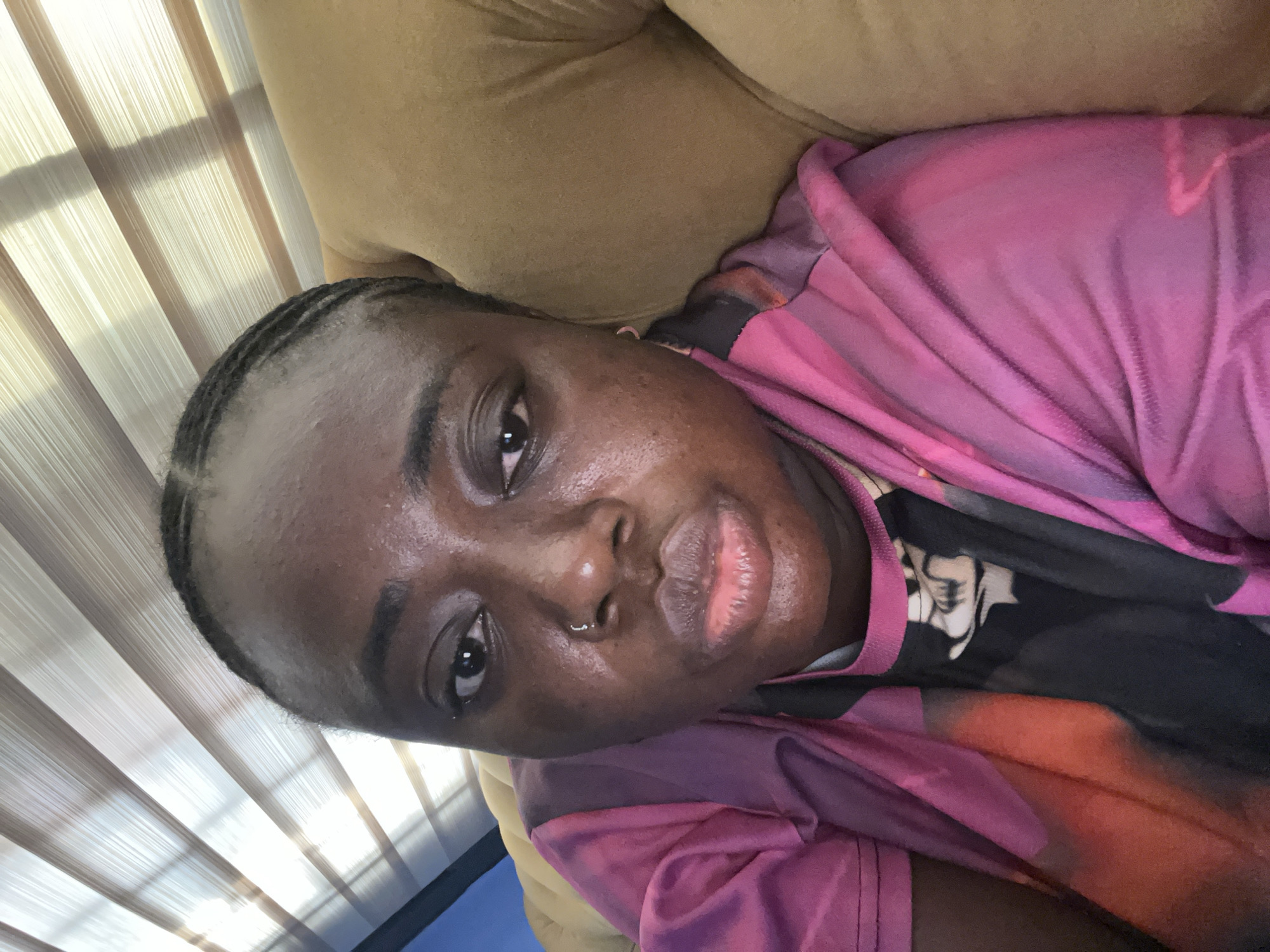 Person photographed relaxing at home in Kubwa, Nigeria