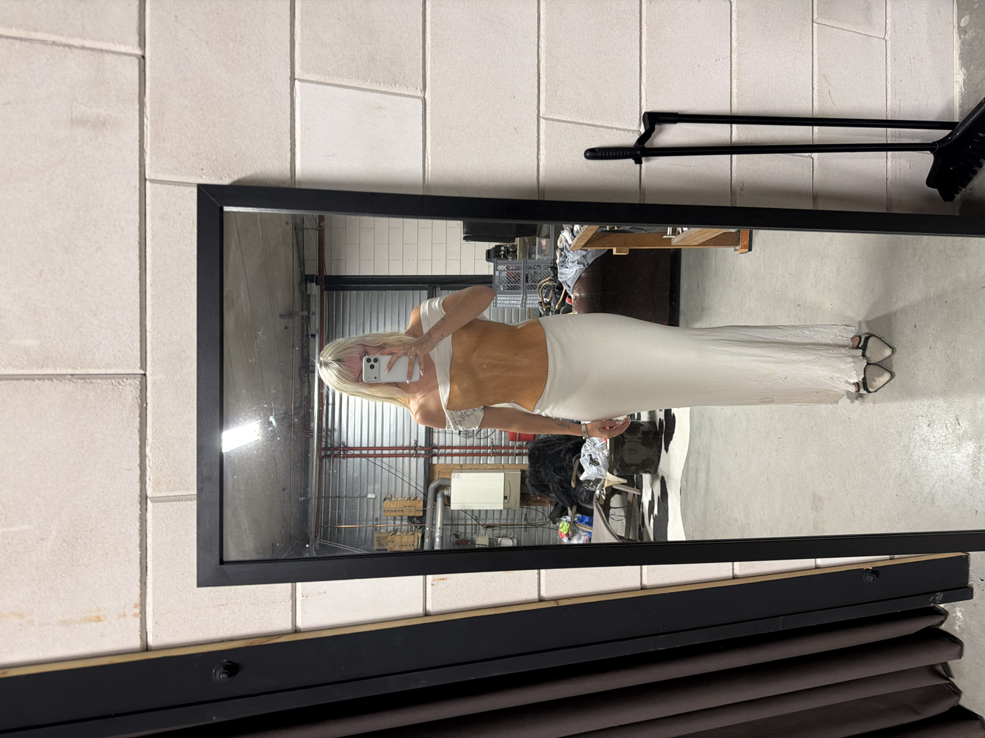 Mirror selfie and worn mannequin in an Amsterdam interior