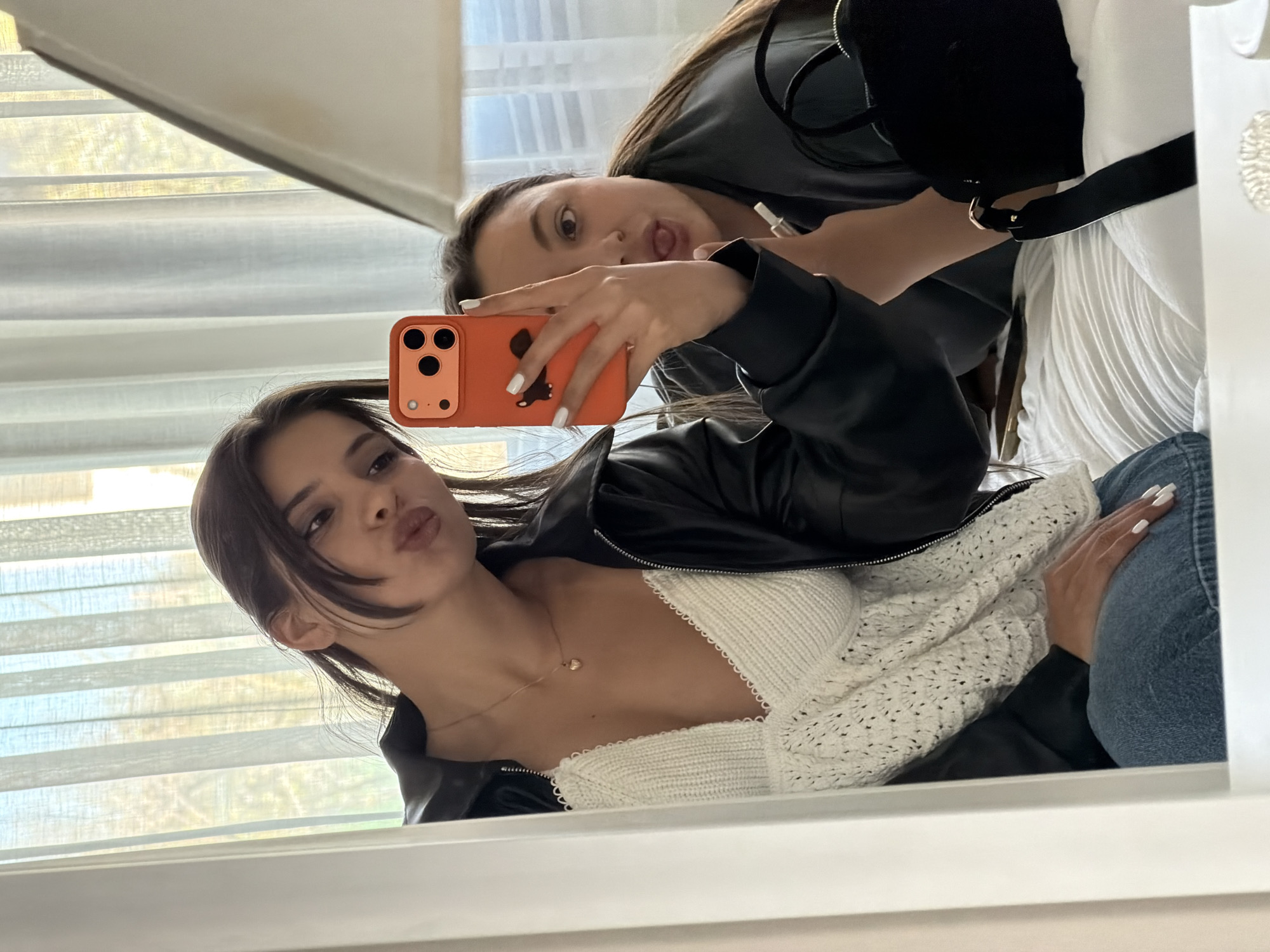 Two women take bedroom selfies, photograph cosmetics in Bulgaria