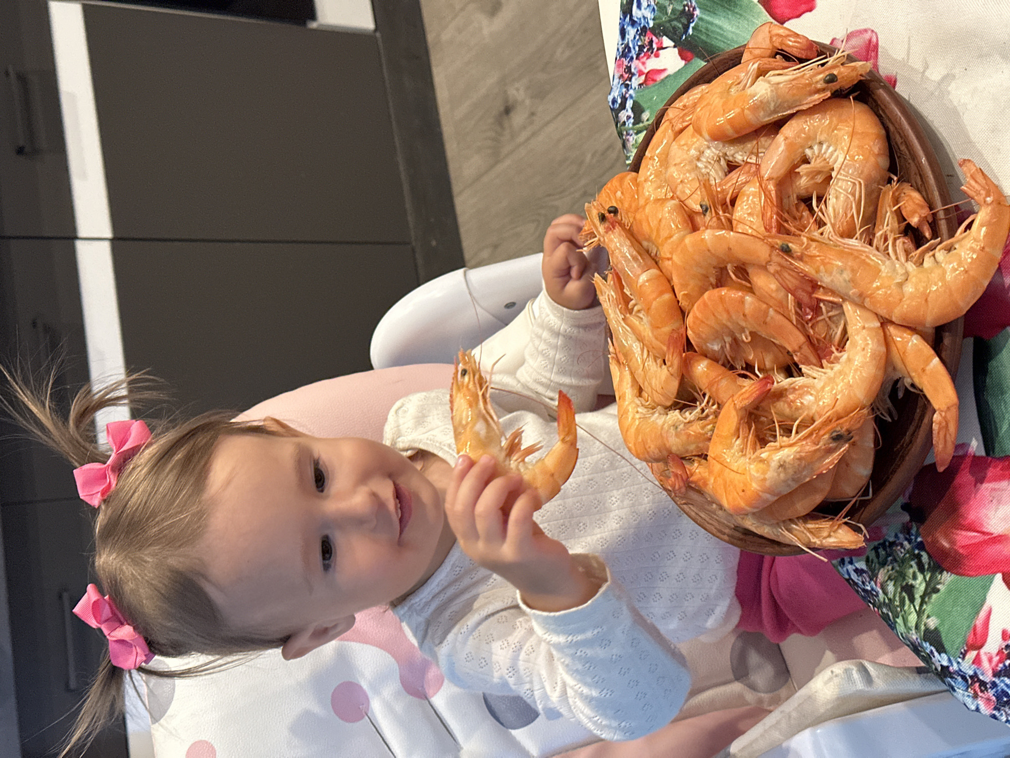 Young girl enjoys shrimp meal, poses in witch costume in Wisła
