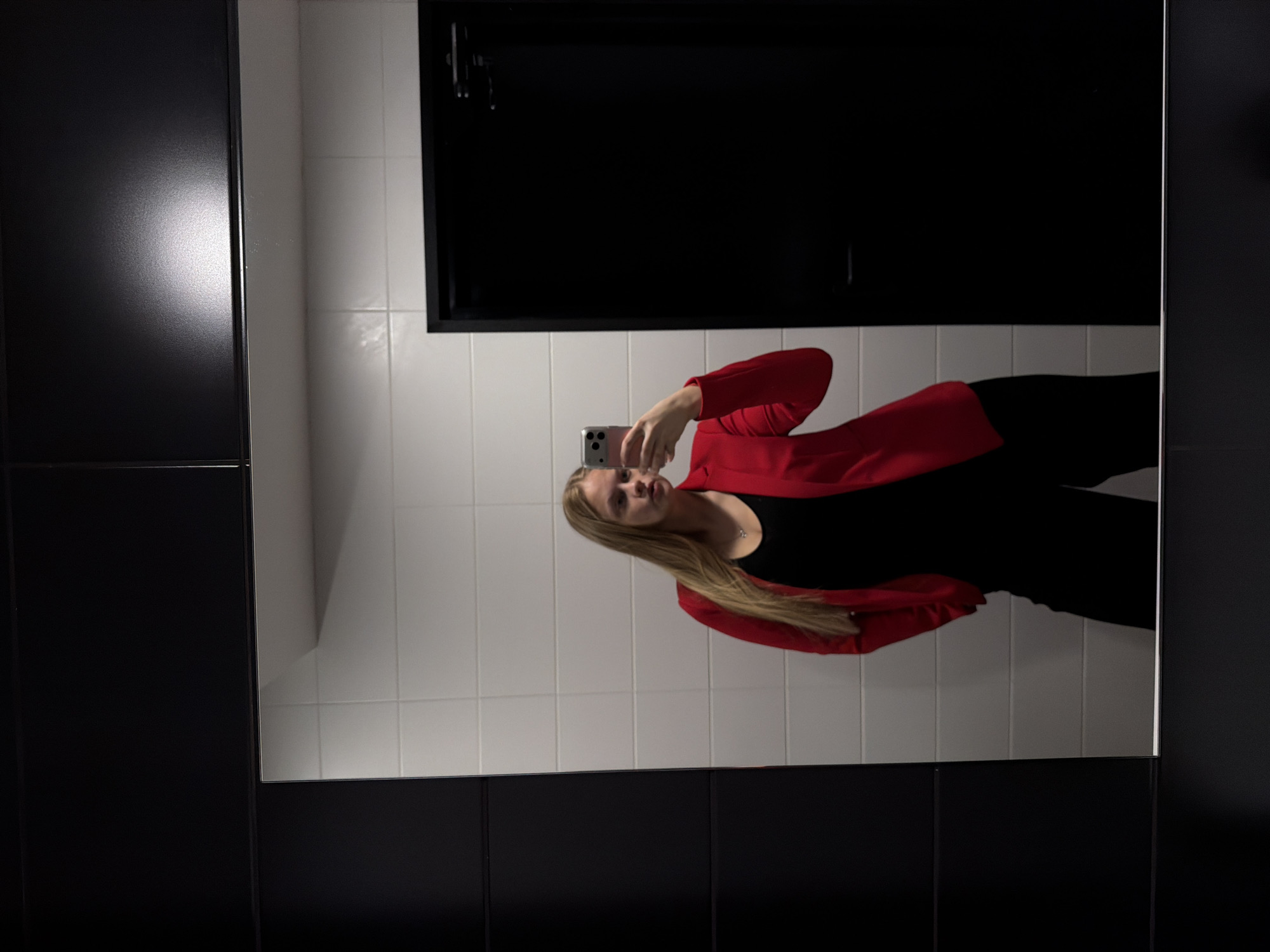 Woman takes mirror selfies in Izhevsk bathroom