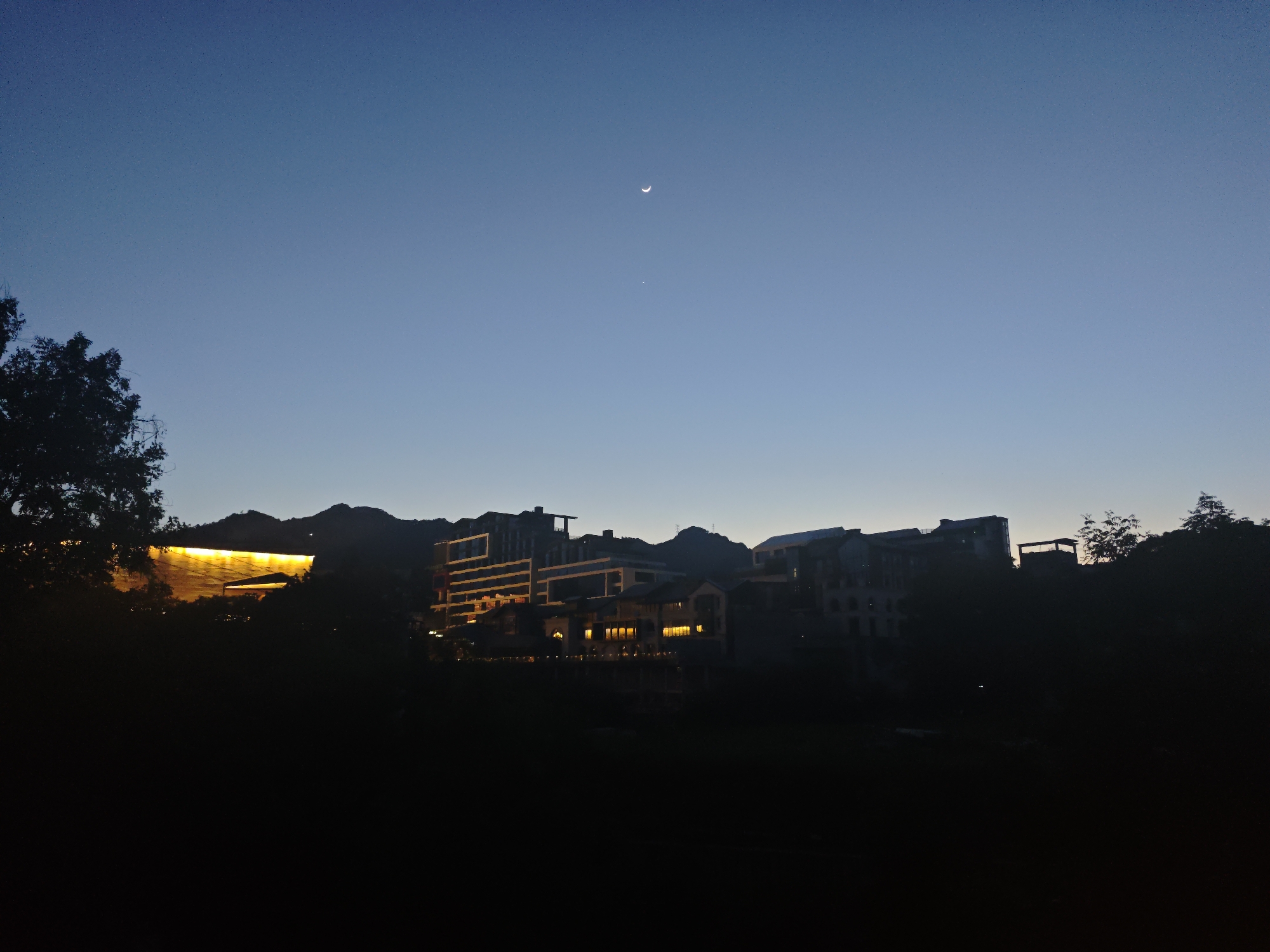Twilight illuminates building complex in Shapingba District, China