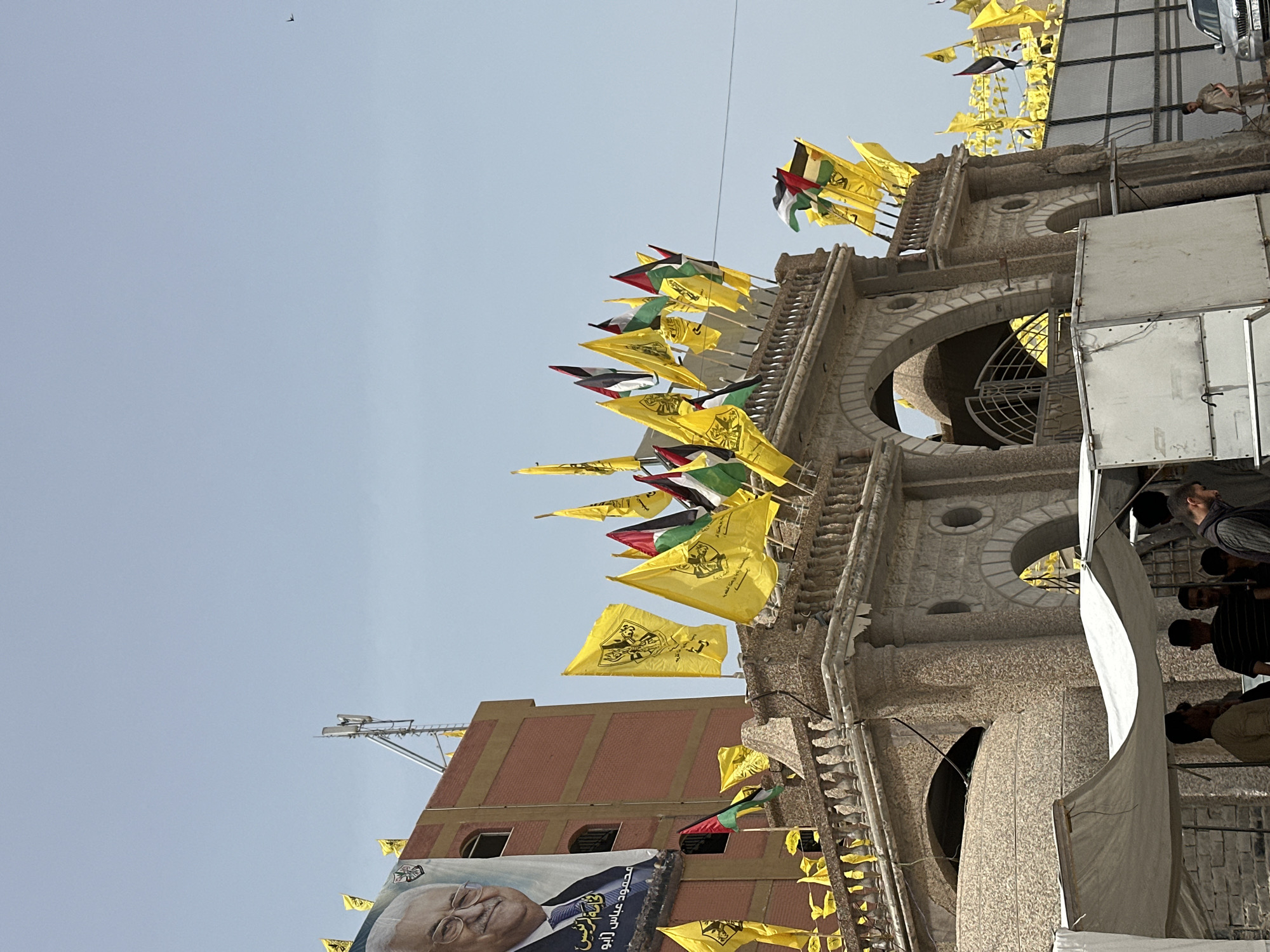 Gaza City streets display yellow and Palestinian flags