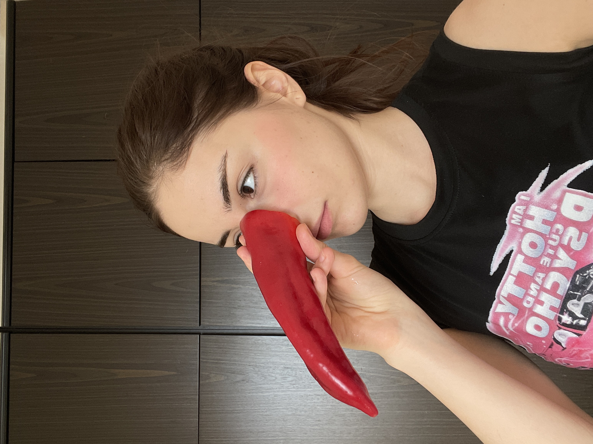 Woman attempts to play red bell pepper as instrument in Moscow