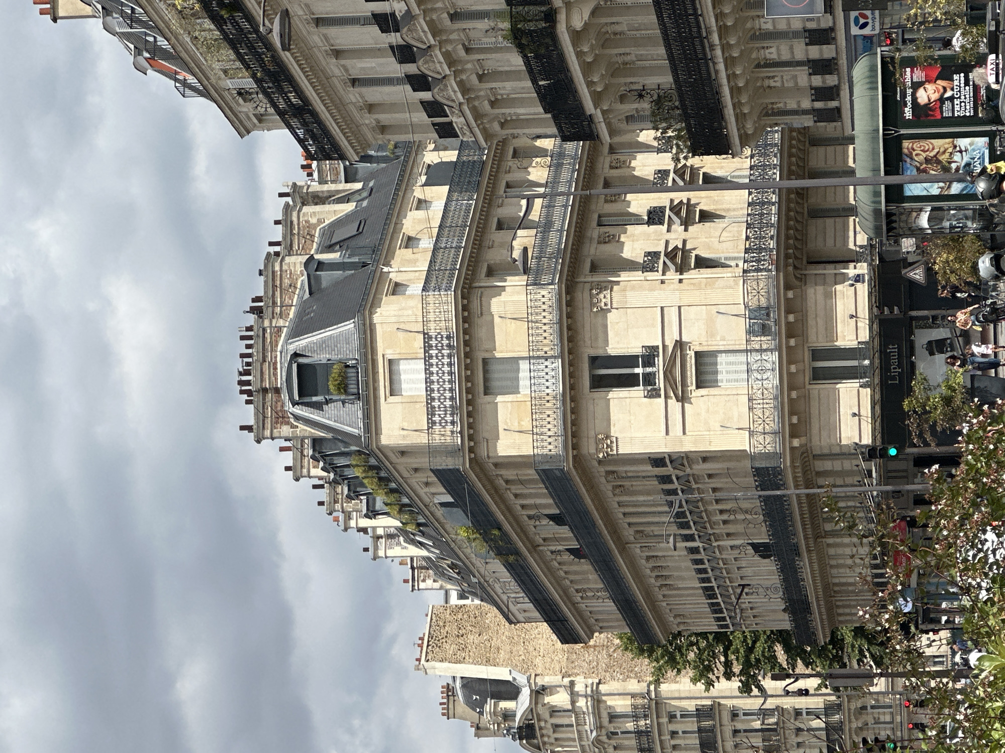 Haussmannian facades and wide avenues on a clear Paris afternoon