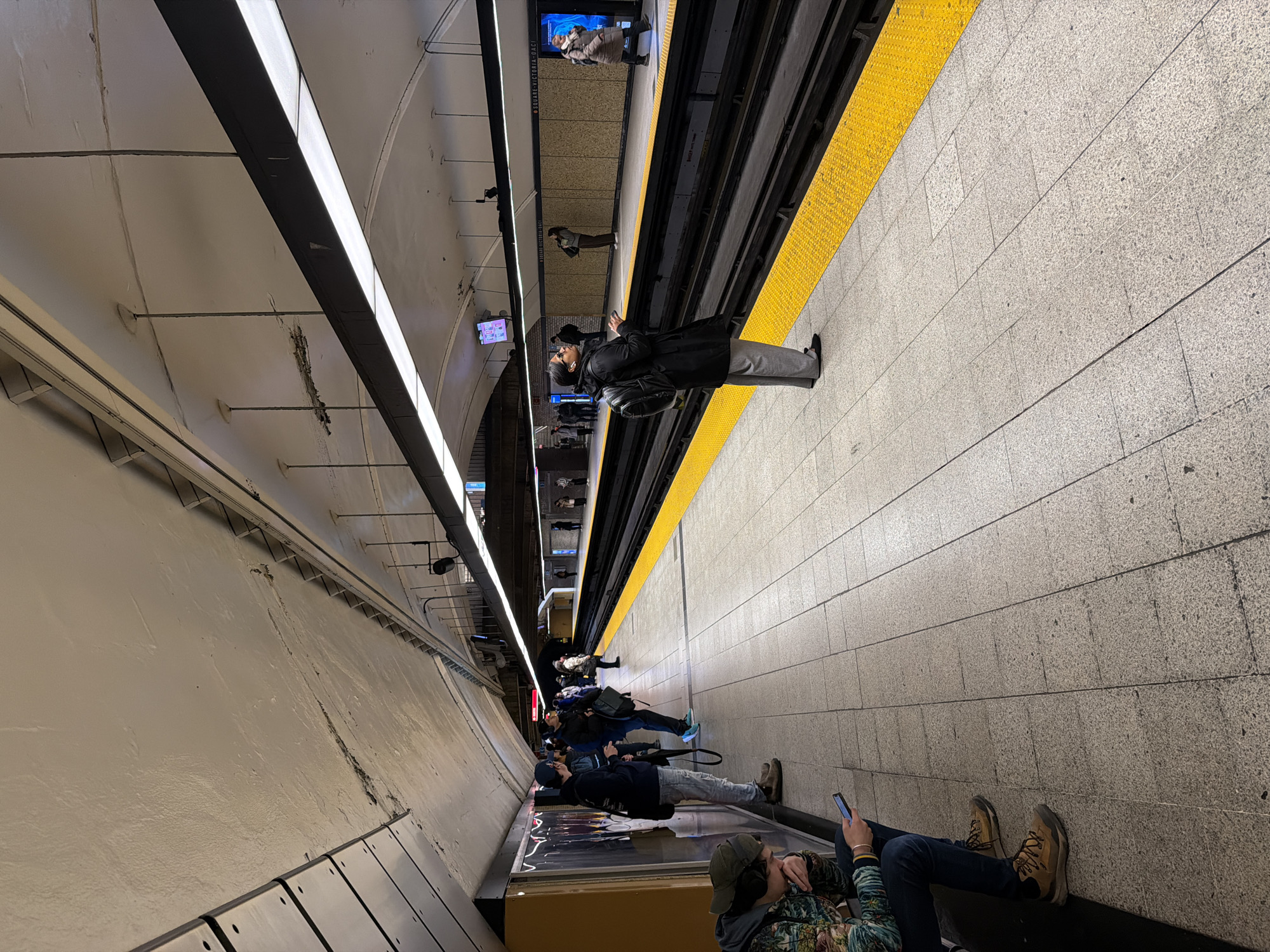 Evening commuters navigate Montreal subway station during rush hour