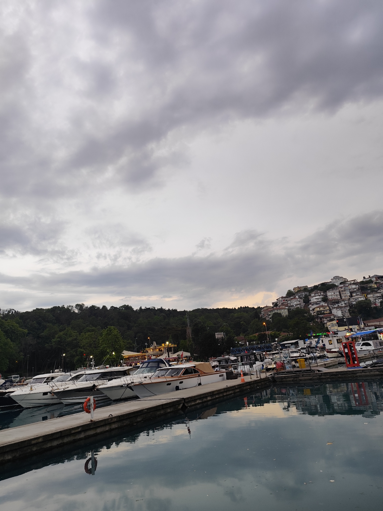 Afternoon street life captured in Sarıyer, Turkey marina district
