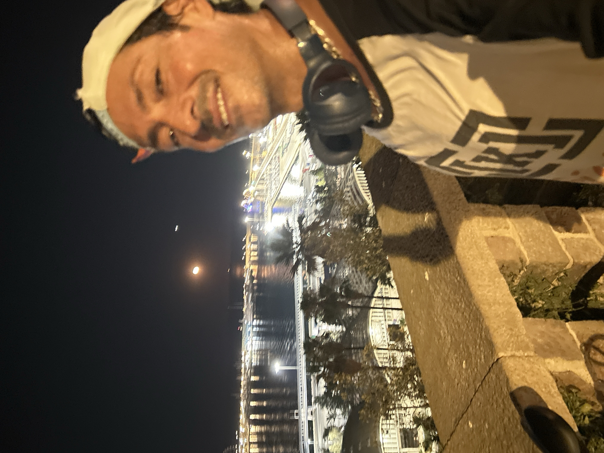Nighttime selfie with Barcelona's cityscape as backdrop