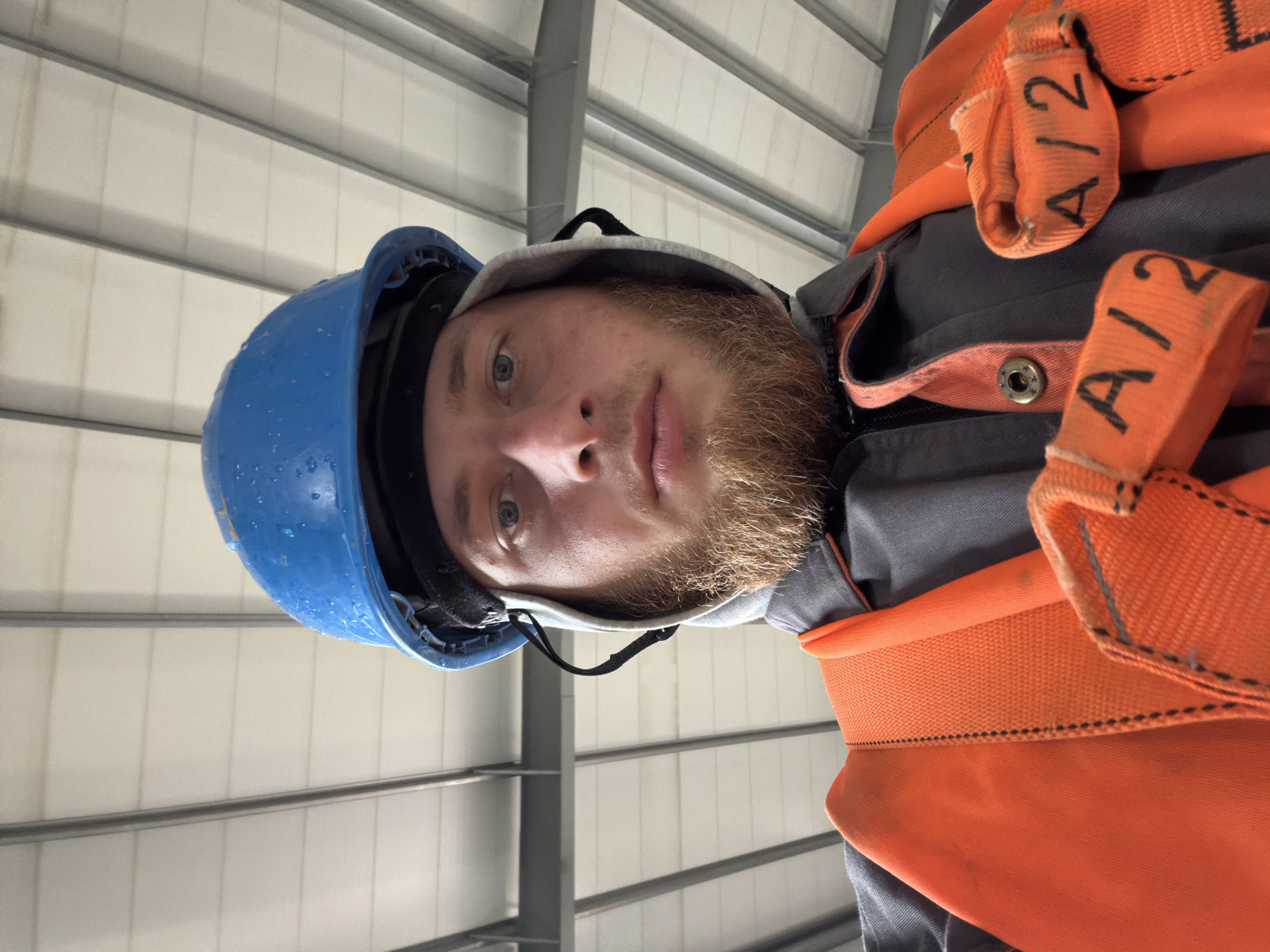 On-site in Janowice: hard hat and safety harness, July 2026