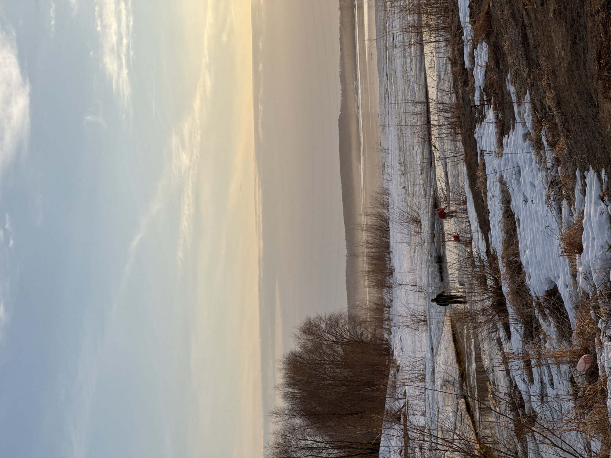 Woman takes selfie under cloudy sky in Chaikovsky