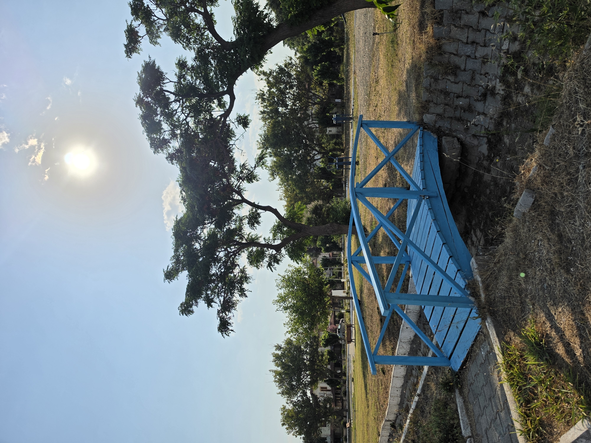 Seferihisar's Aegean pebble beach on a clear summer morning
