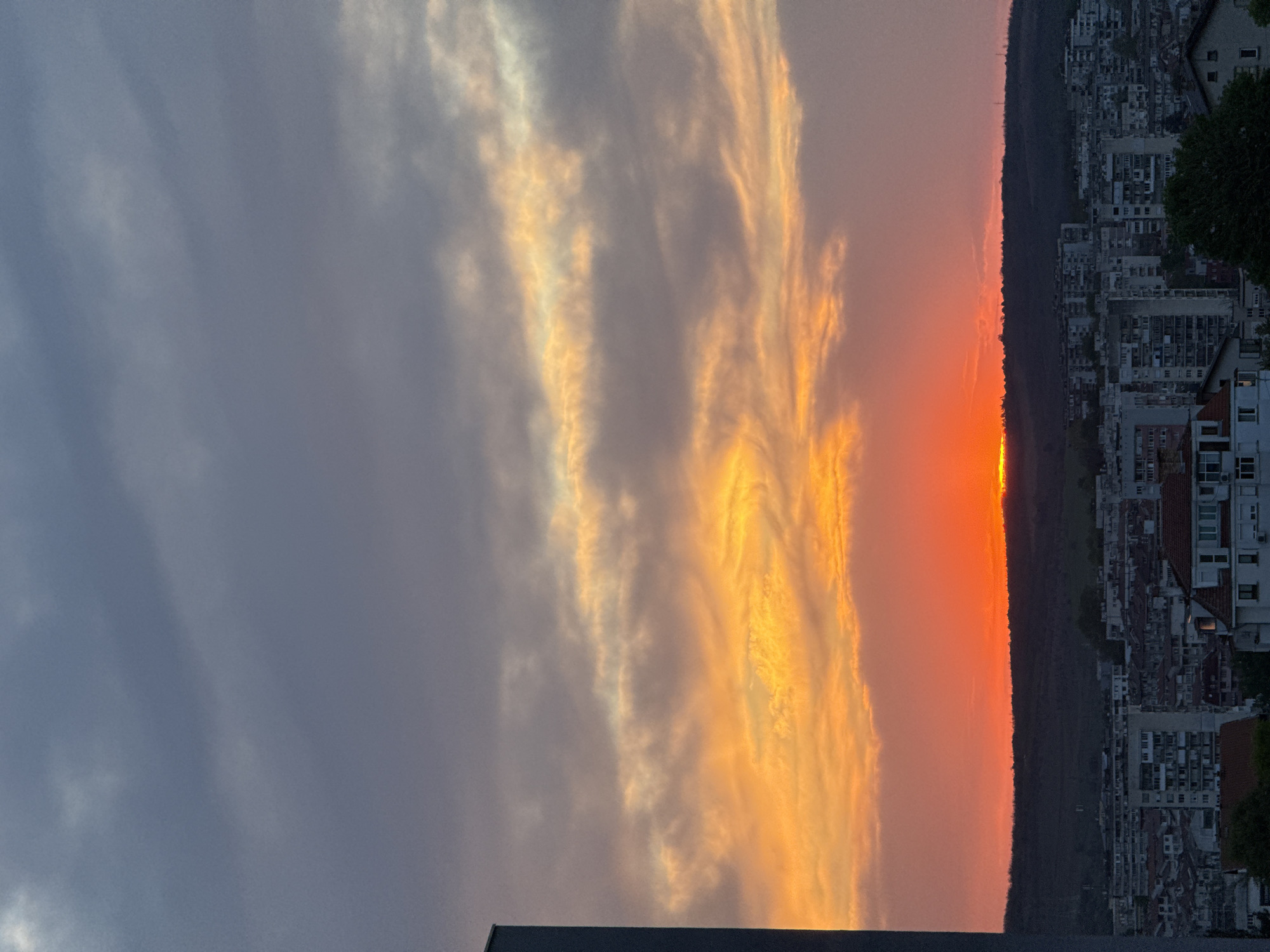 Sunset captured over apartment-covered hills in Pleven, Bulgaria