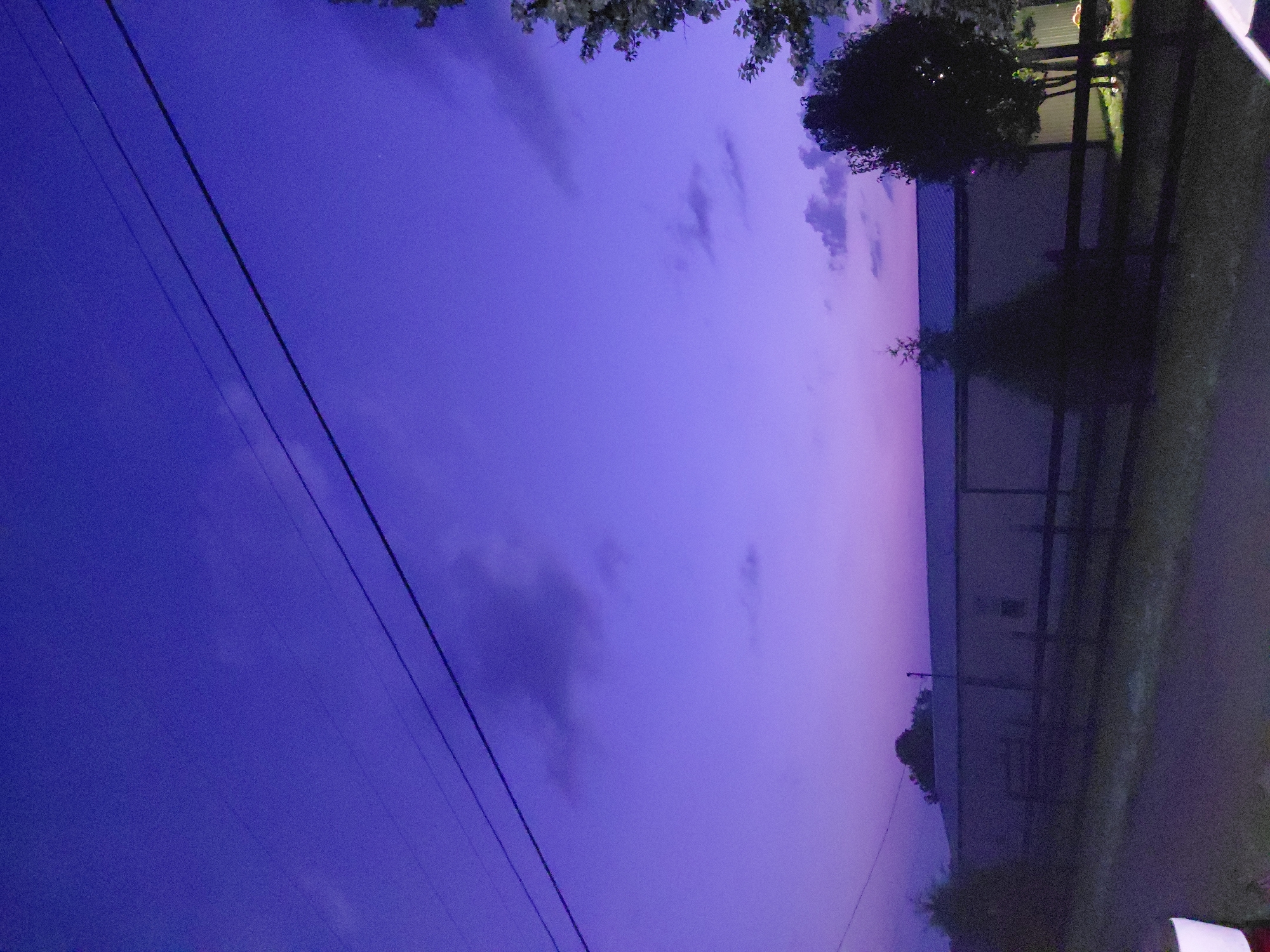 Twilight settles over a flat-roofed building in Richmond, Kentucky