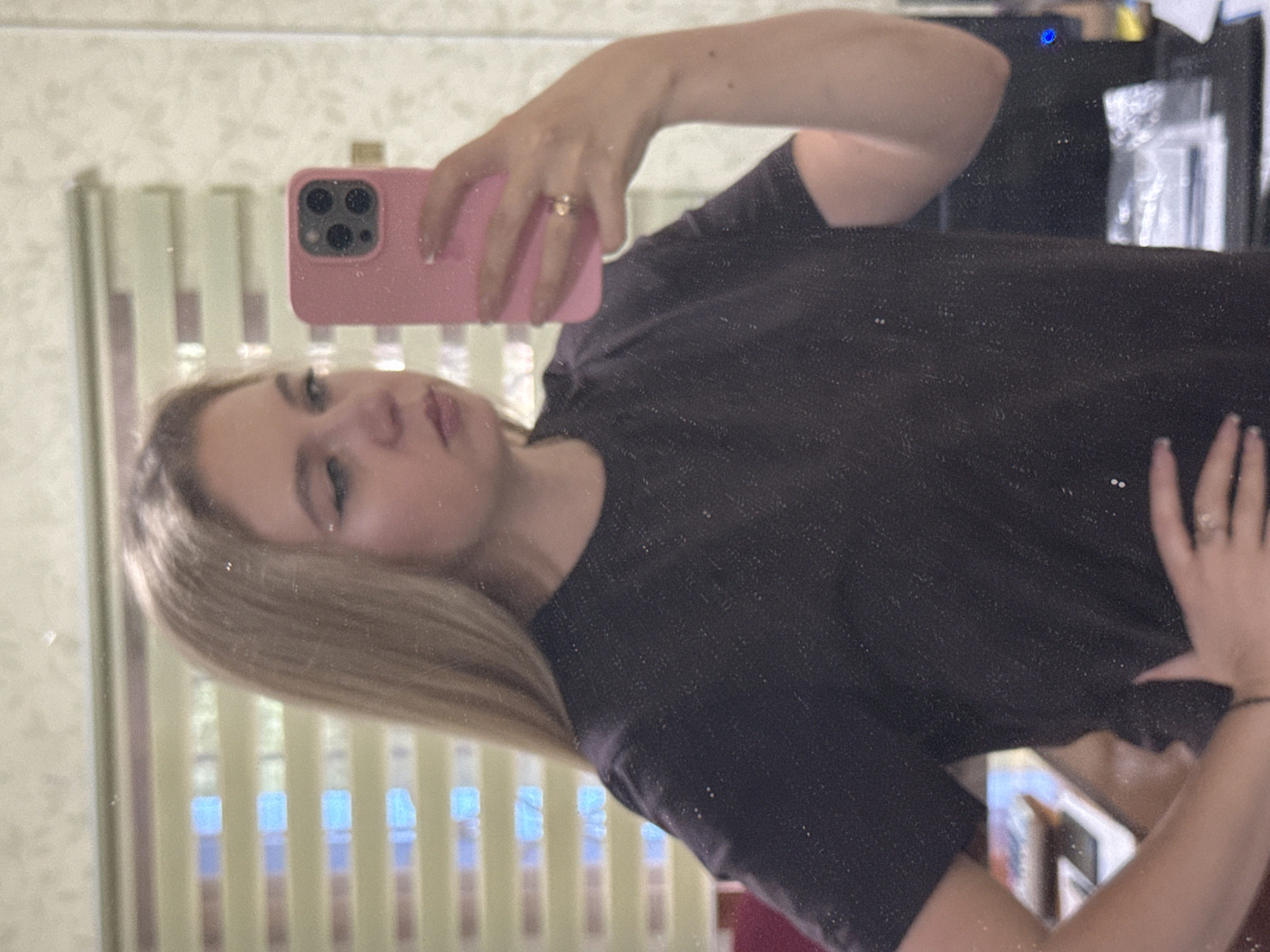 Selfie session in a floral-wallpapered room, multiple angles