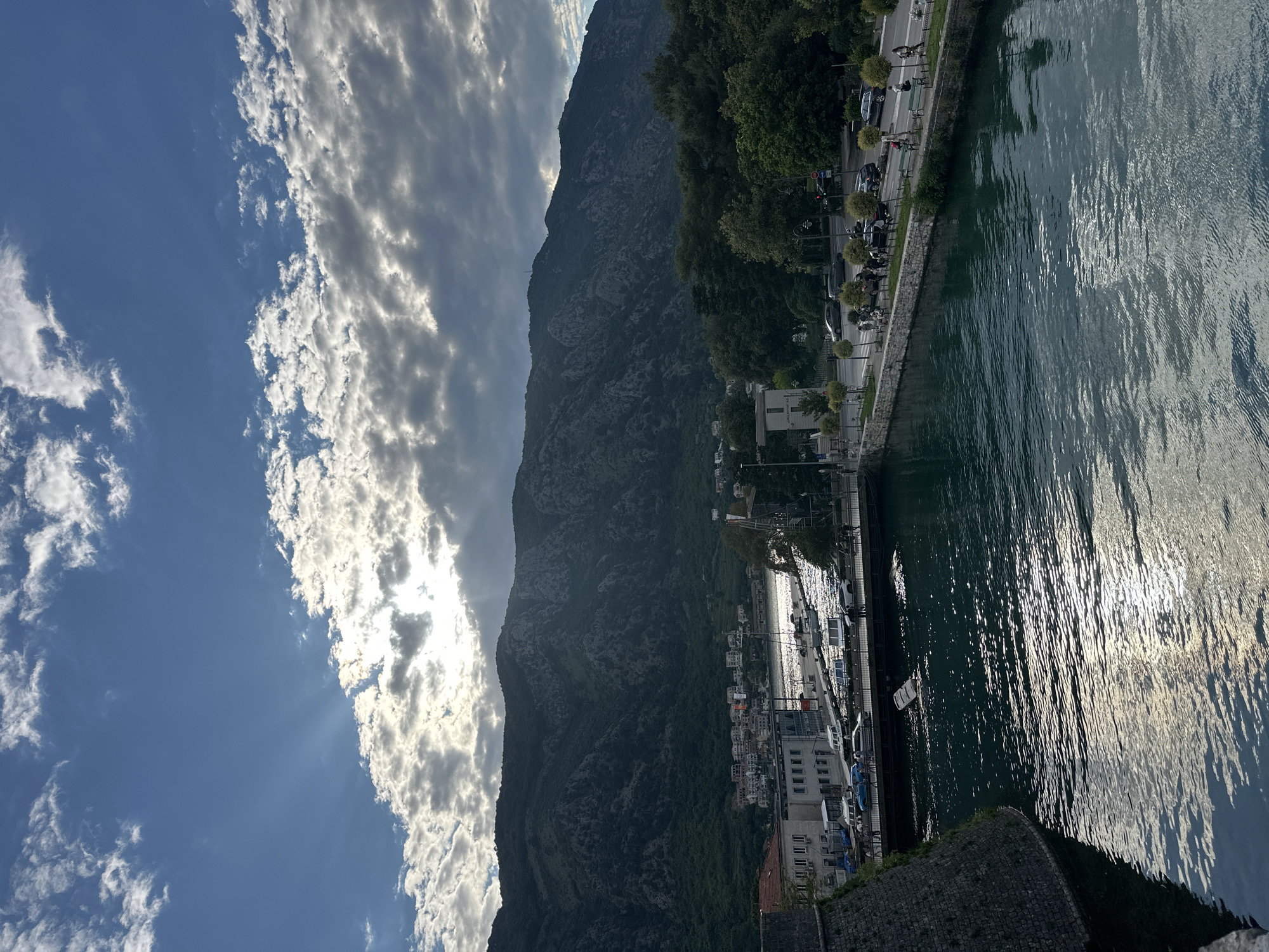 Tourist captures scenic views of Kotor Montenegro waterfront