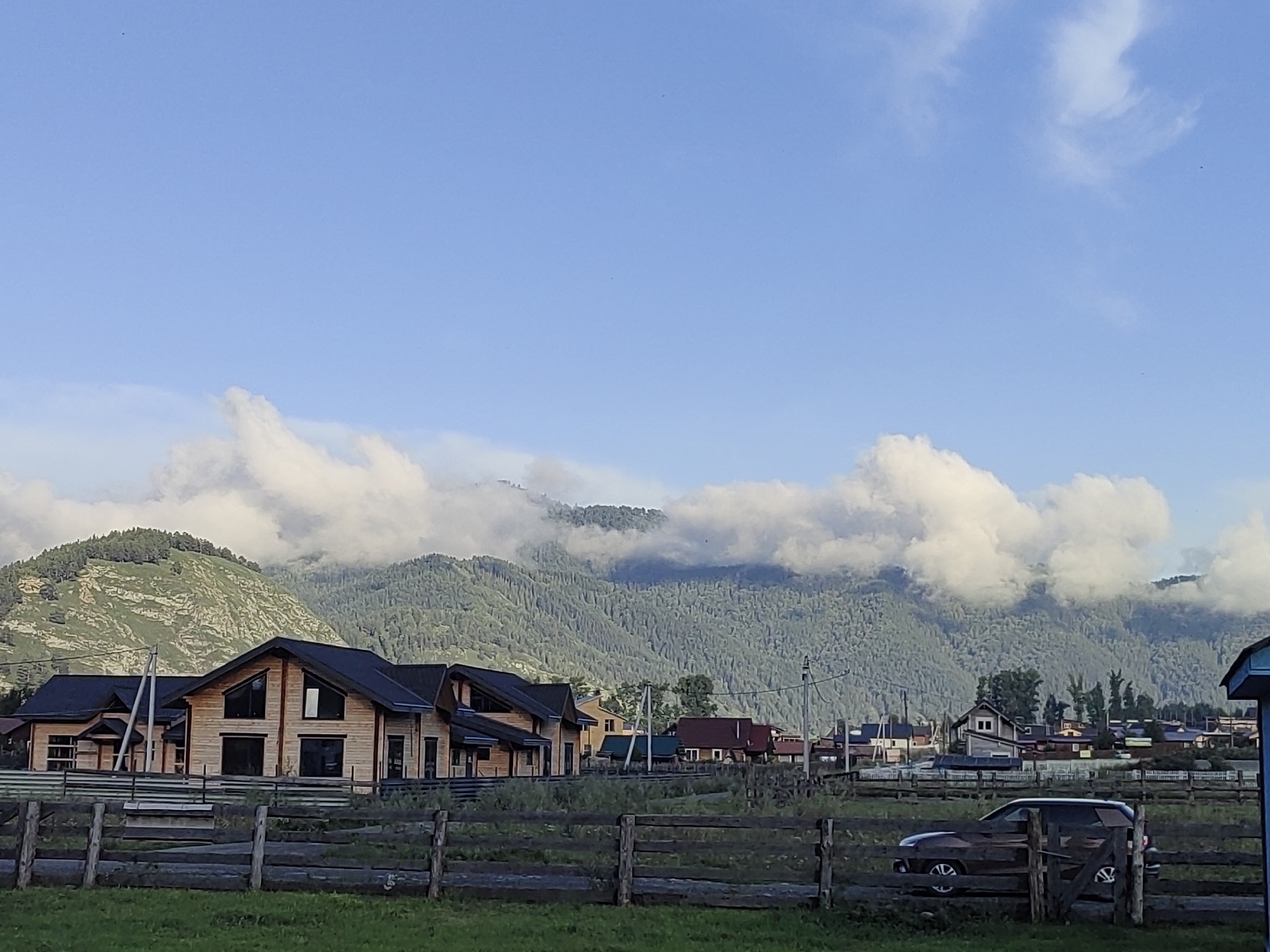 Rural village life in Anos, Russia, with mountain views