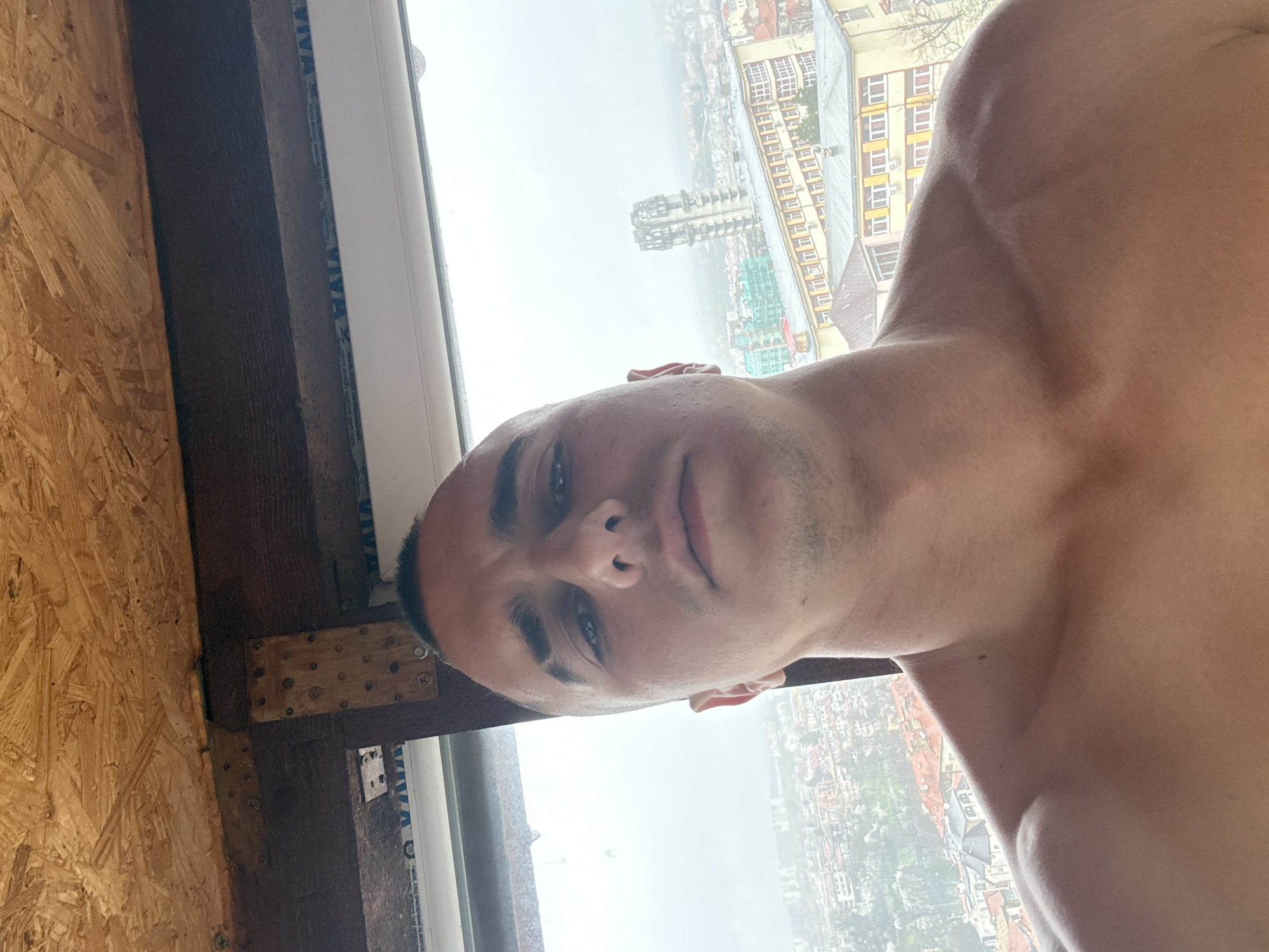 Man takes morning selfie with Shumen cityscape view