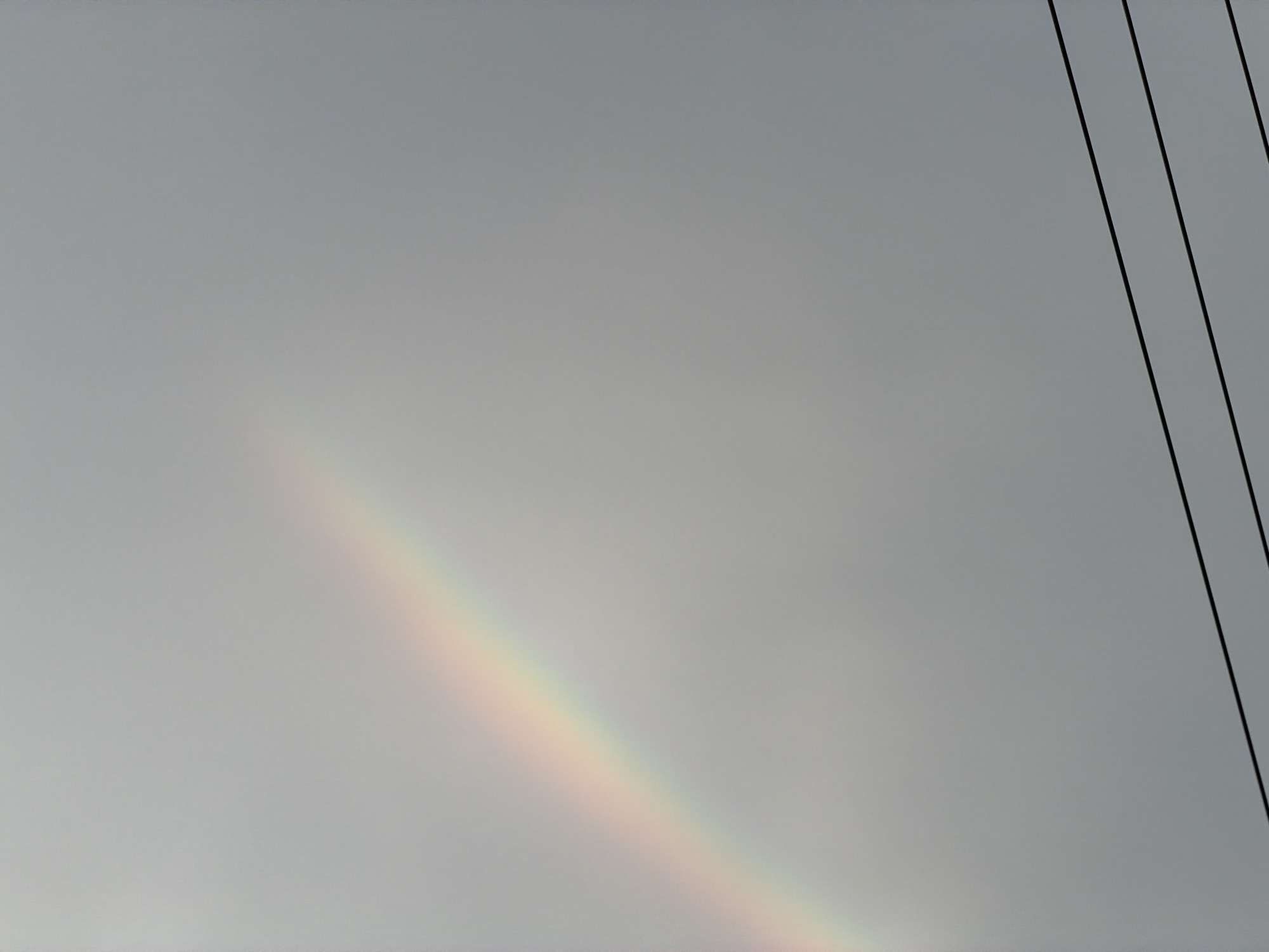 Faint rainbow spotted across multiple Vietnamese districts during overcast morning