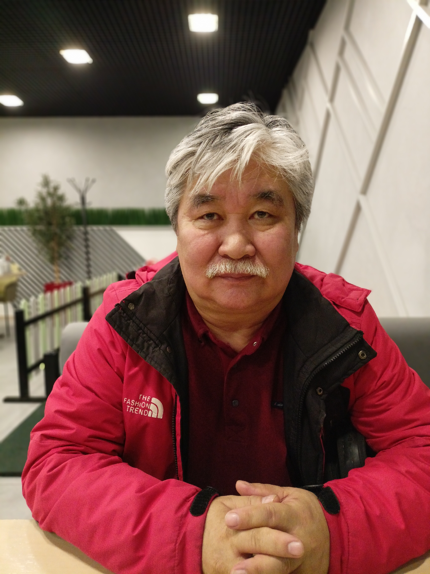 Man dining at Novosibirsk cafeteria during early morning hours
