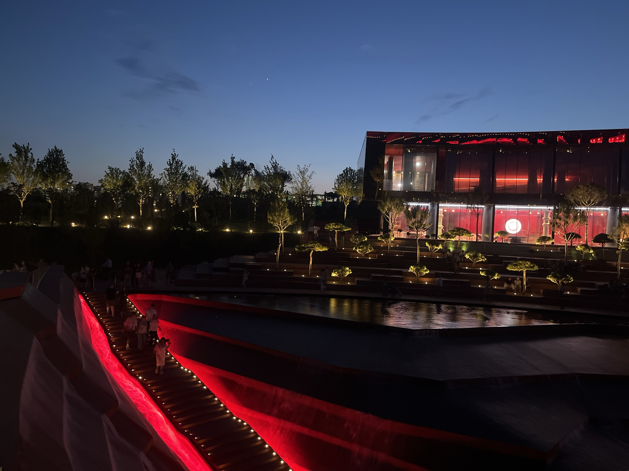 Evening documentation of illuminated Krasnodar park attractions and sculptures