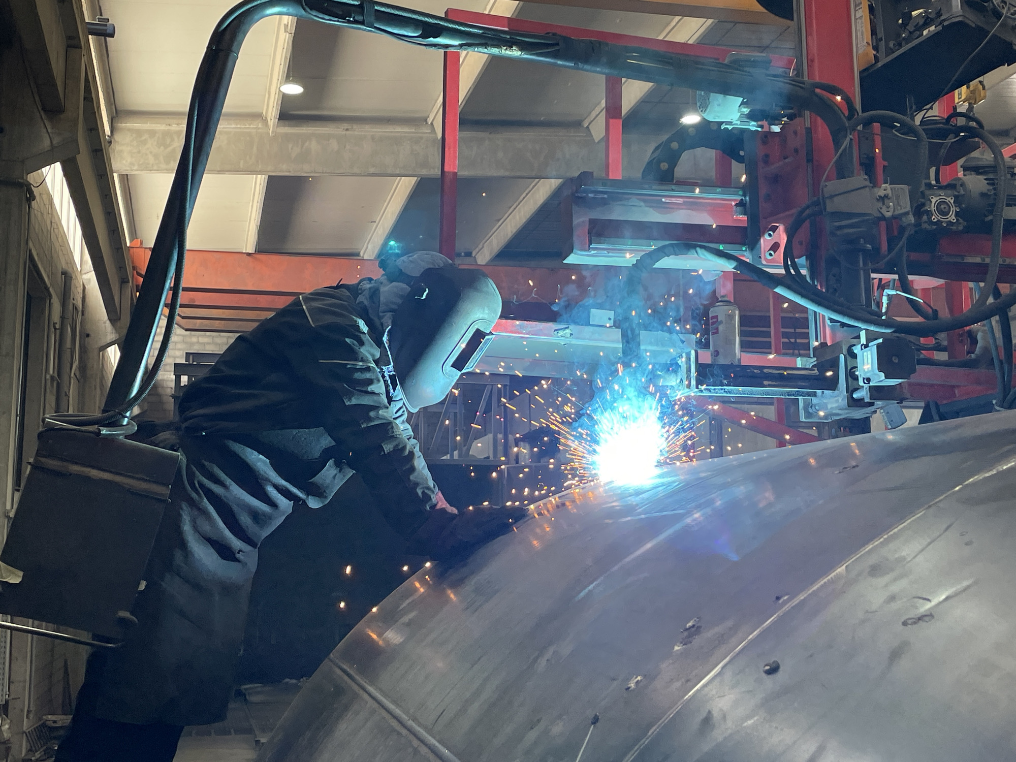 Welder works on metal structure in Montenegro