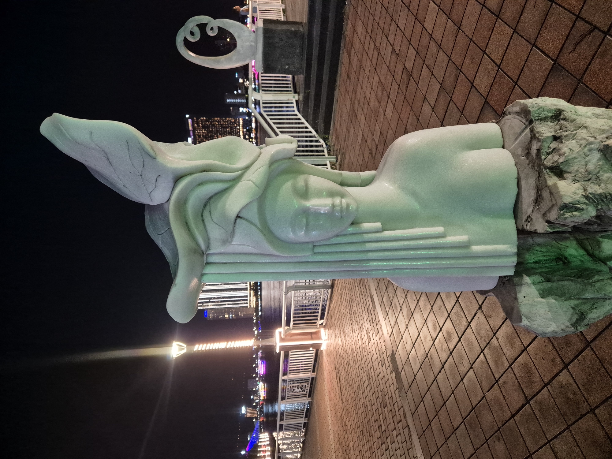 Marble sculpture collection documented along Đà Nẵng riverfront at night