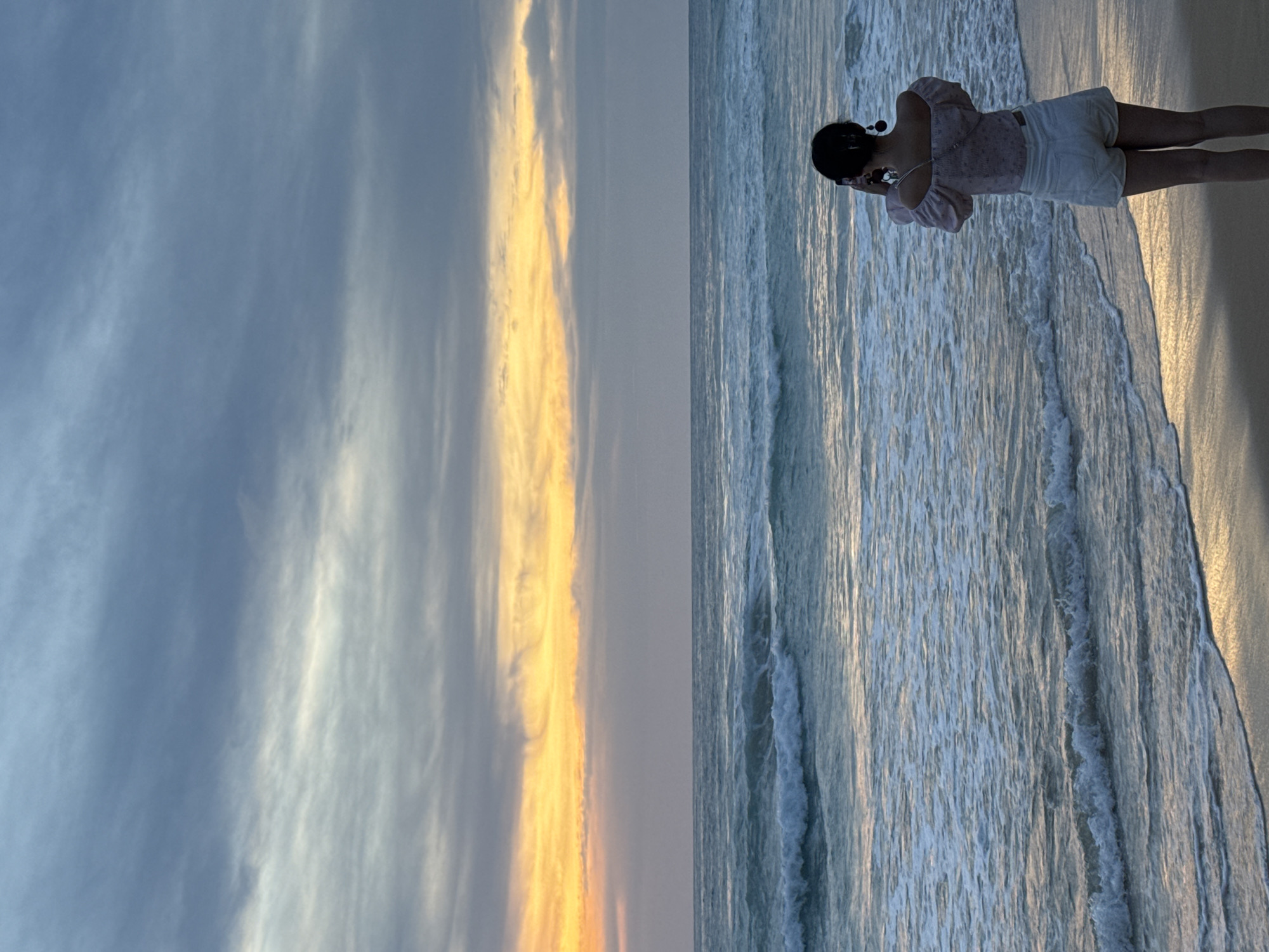 Karon Beach at dusk: shoreline strolls and parasailing