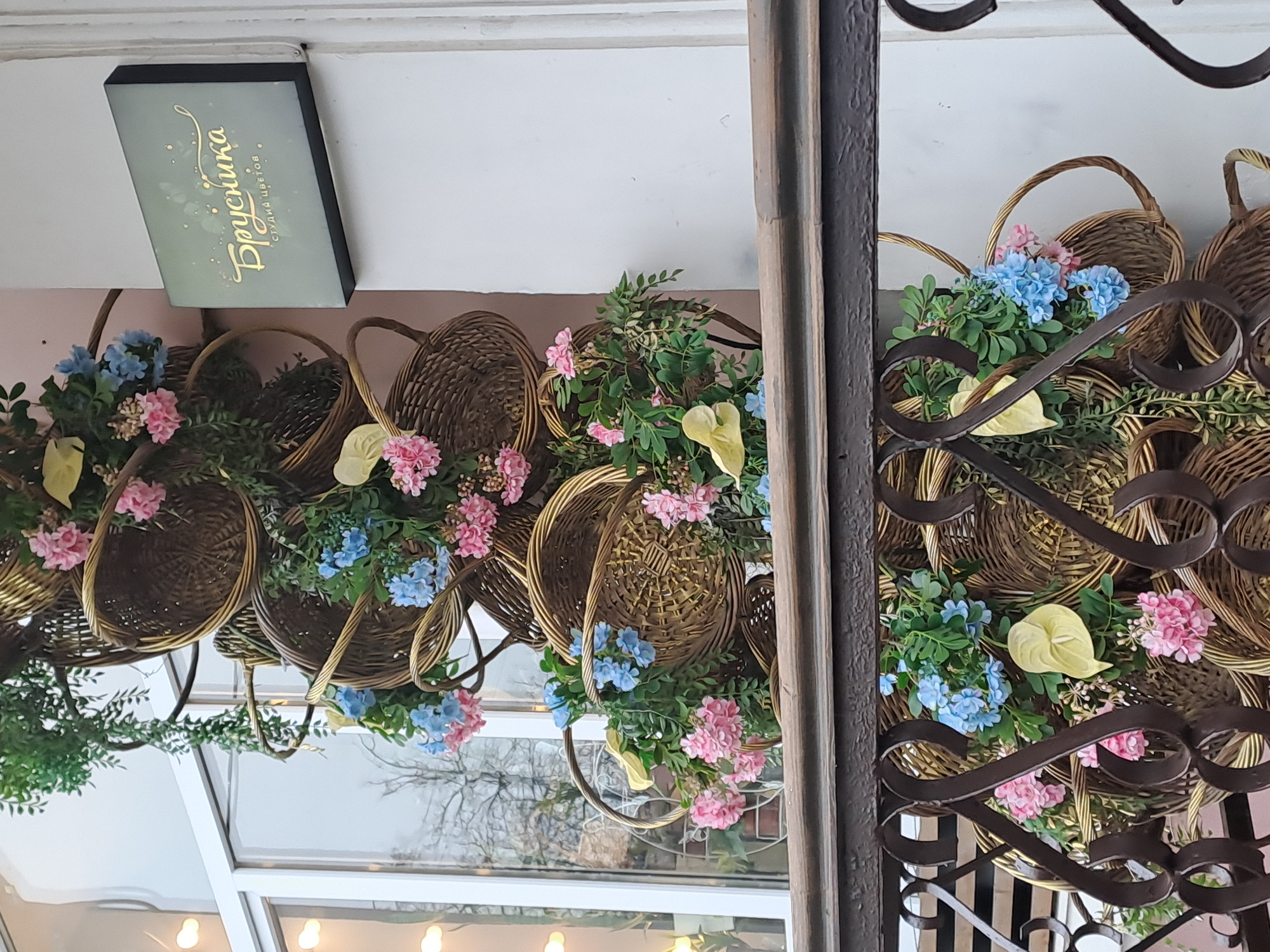 Floral decorations spotted at building entrance in Elektrostal