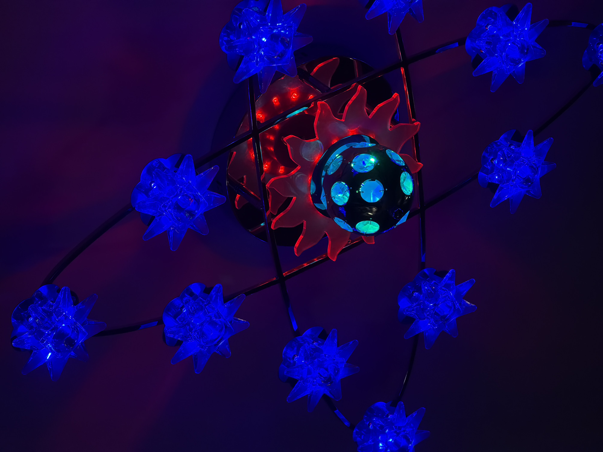Multi-colored decorative light fixture observed at unknown location