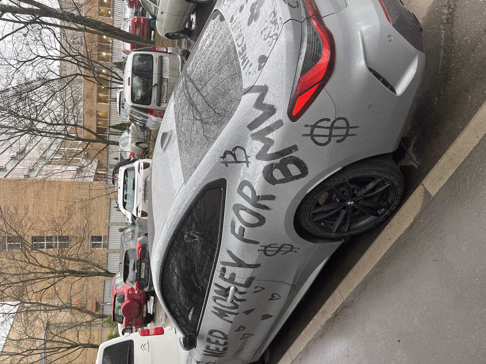 Graffitied BMW spotted in Moscow with money plea message