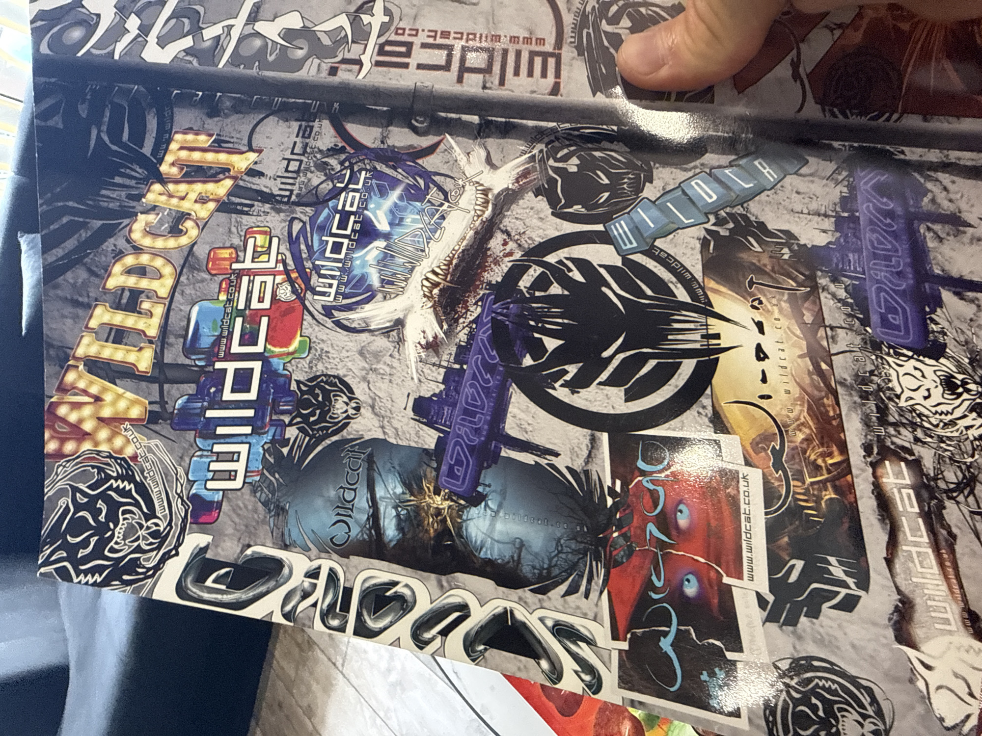 Tattoo enthusiast browses magazines and studio materials in Sofia