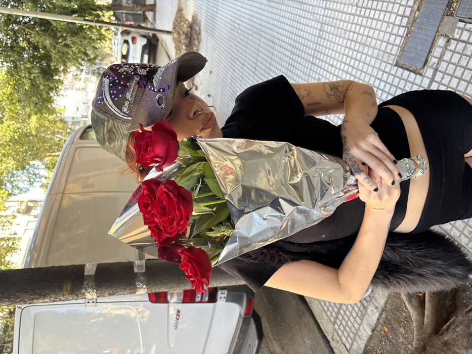 Woman with red roses spotted on Buenos Aires street Valentine's Day