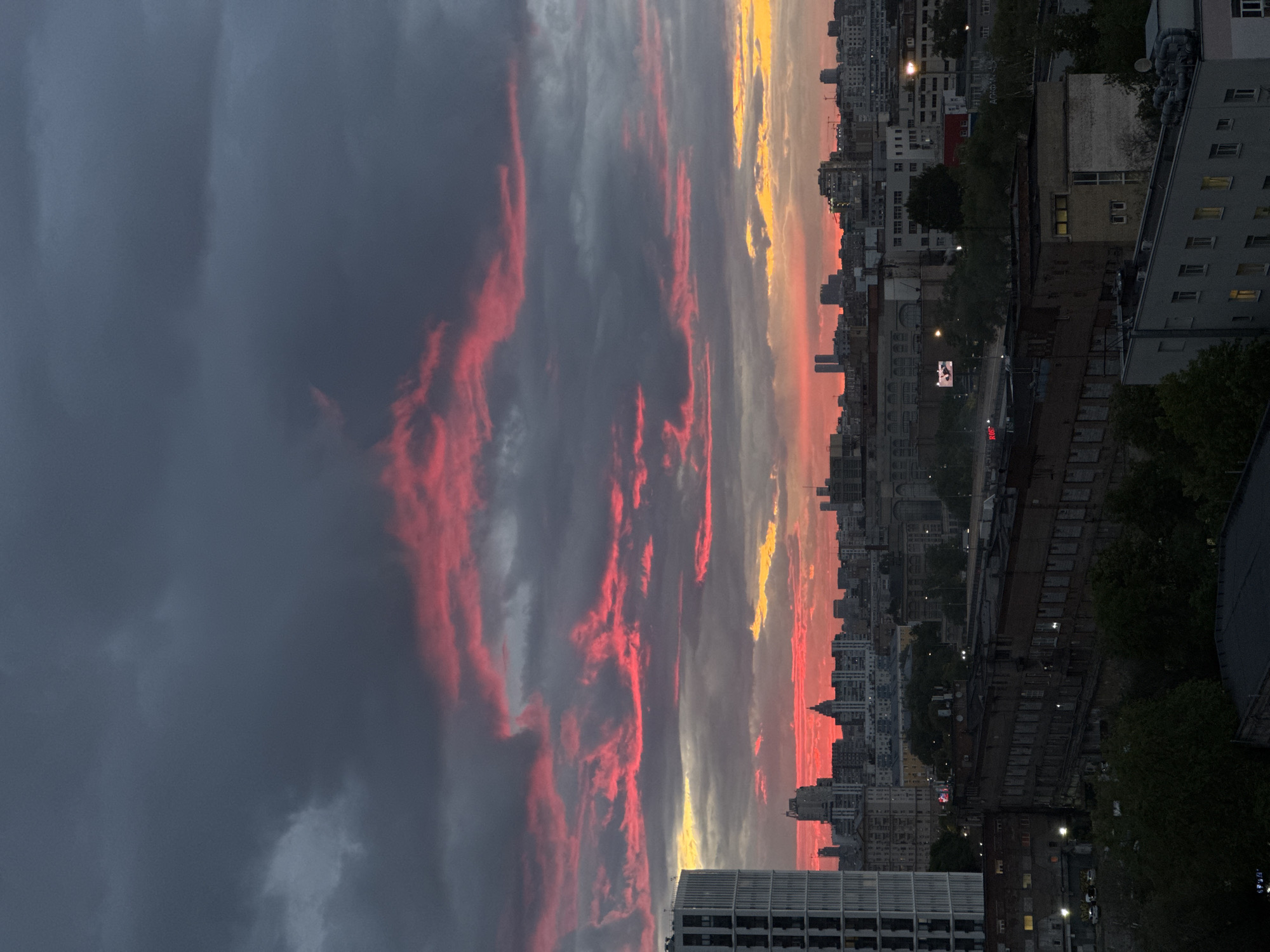 Dramatic sunset illuminates Moscow skyline with vibrant colors