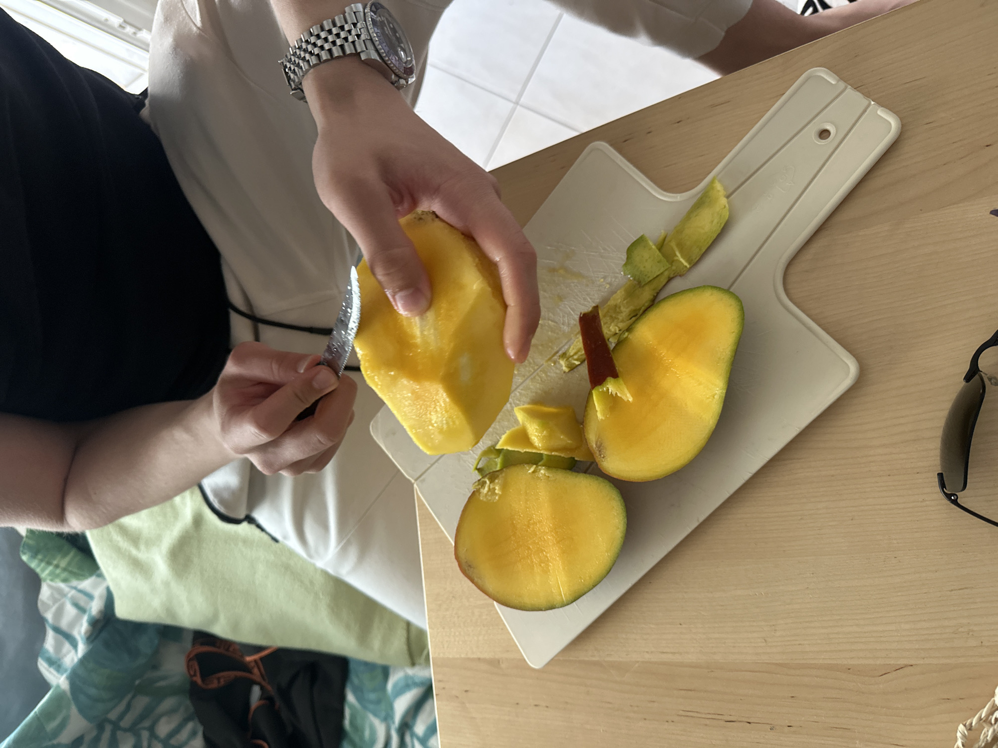 Casual food preparation and daily activities documented at Greek beach