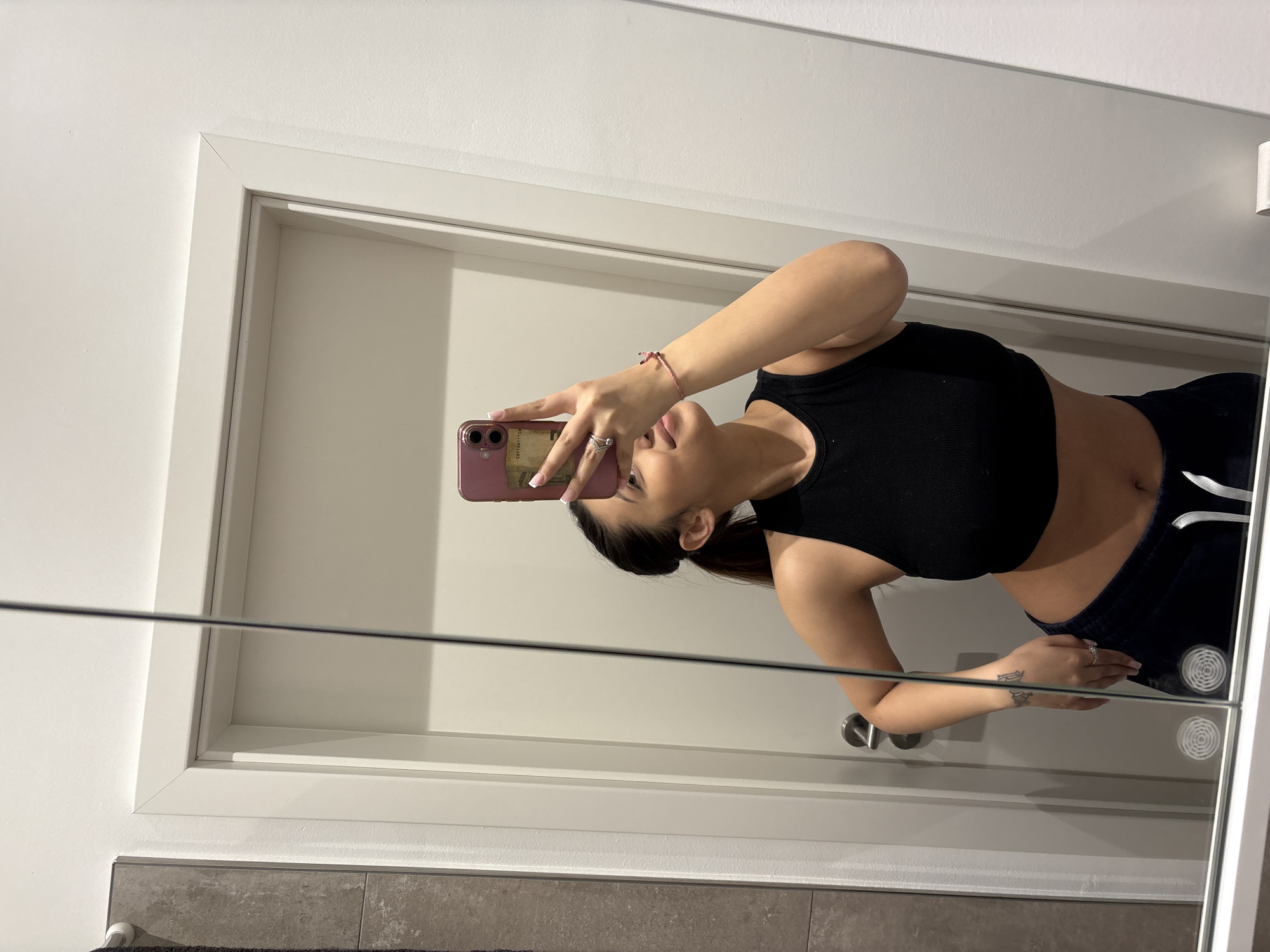 Woman takes mirror selfie in Mönchengladbach apartment