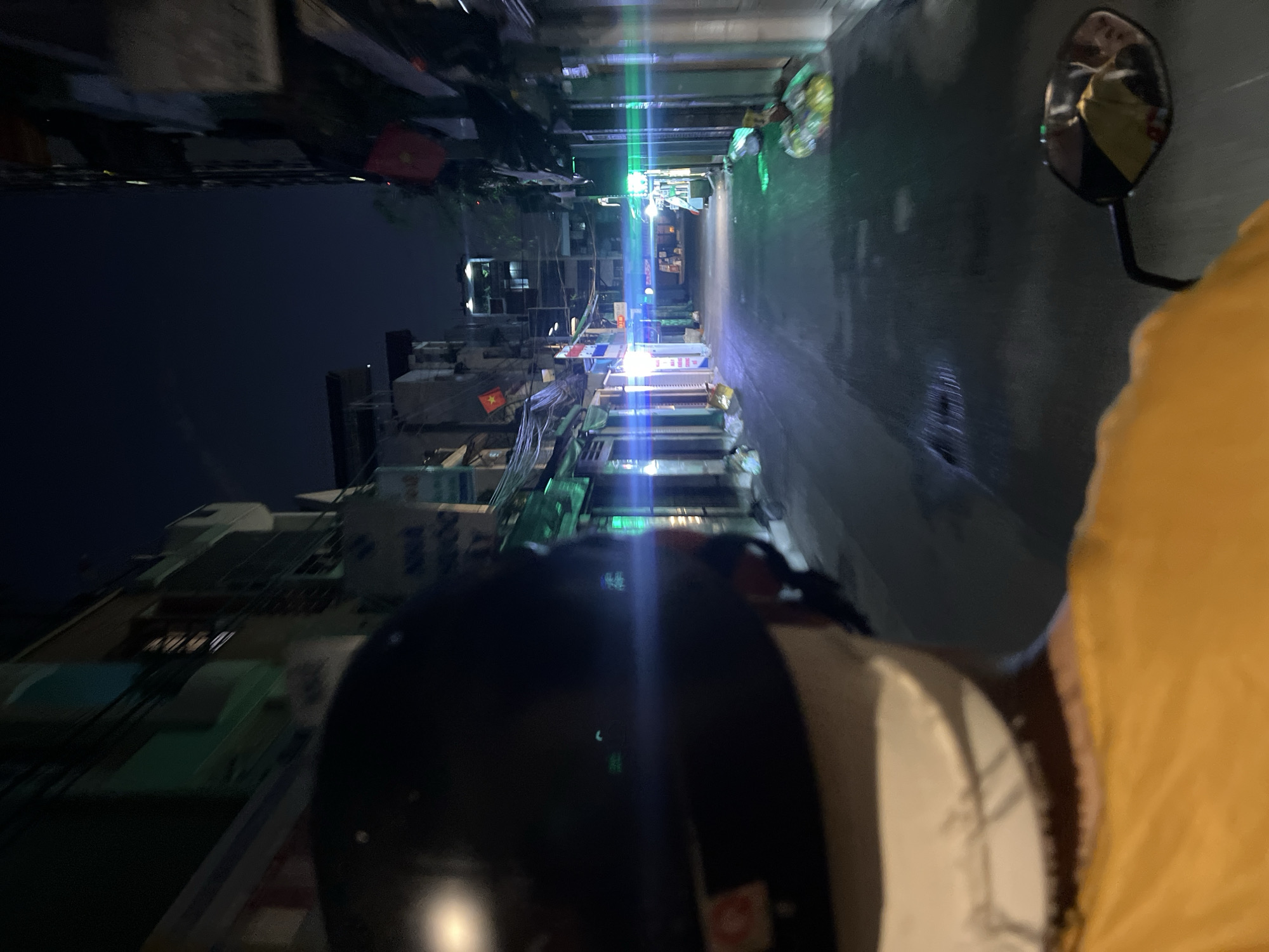 Nighttime motorbike journey documented on Thủ Đức street