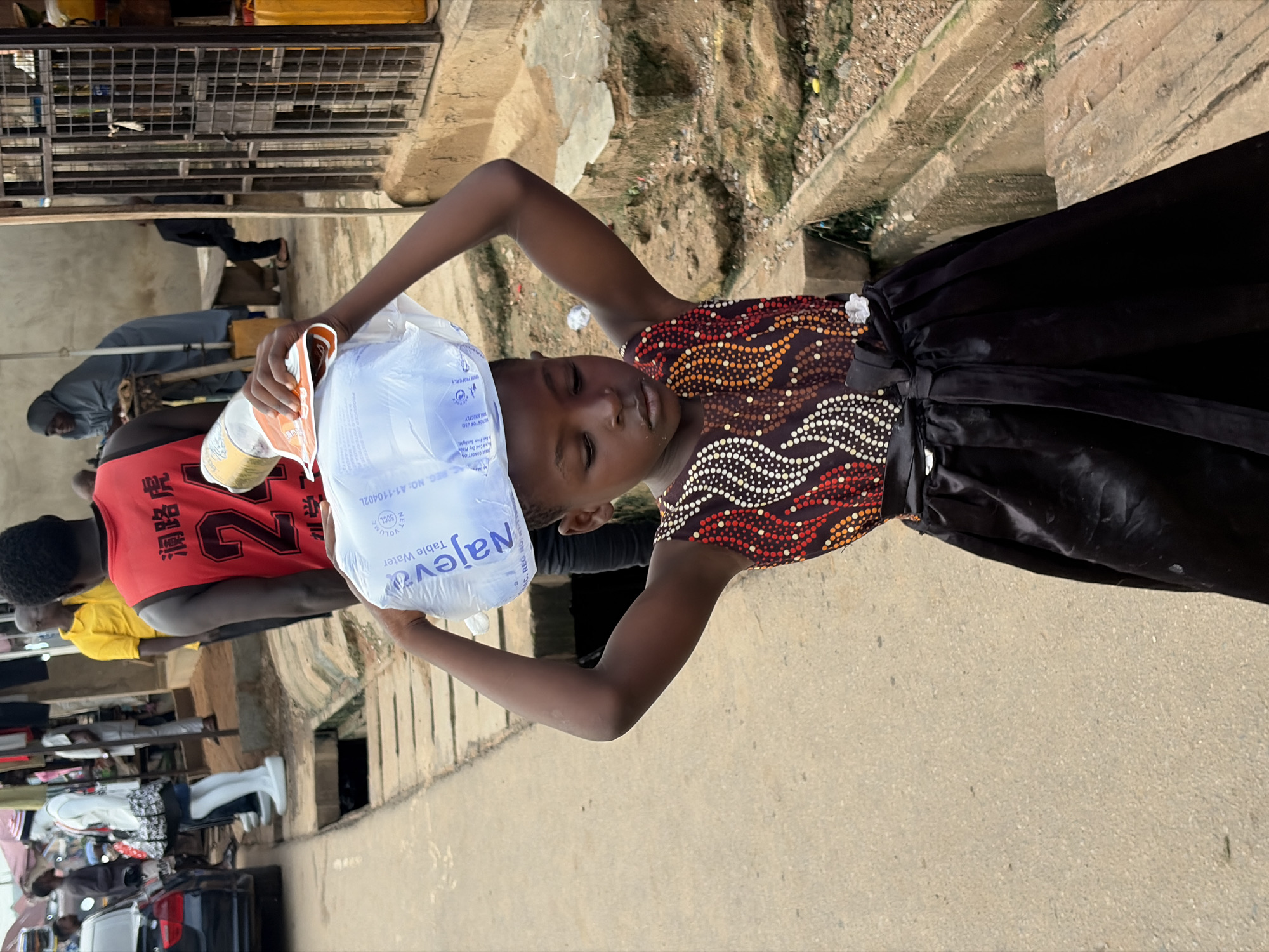 Street life and commerce along a Sabojibi, Nigeria market strip