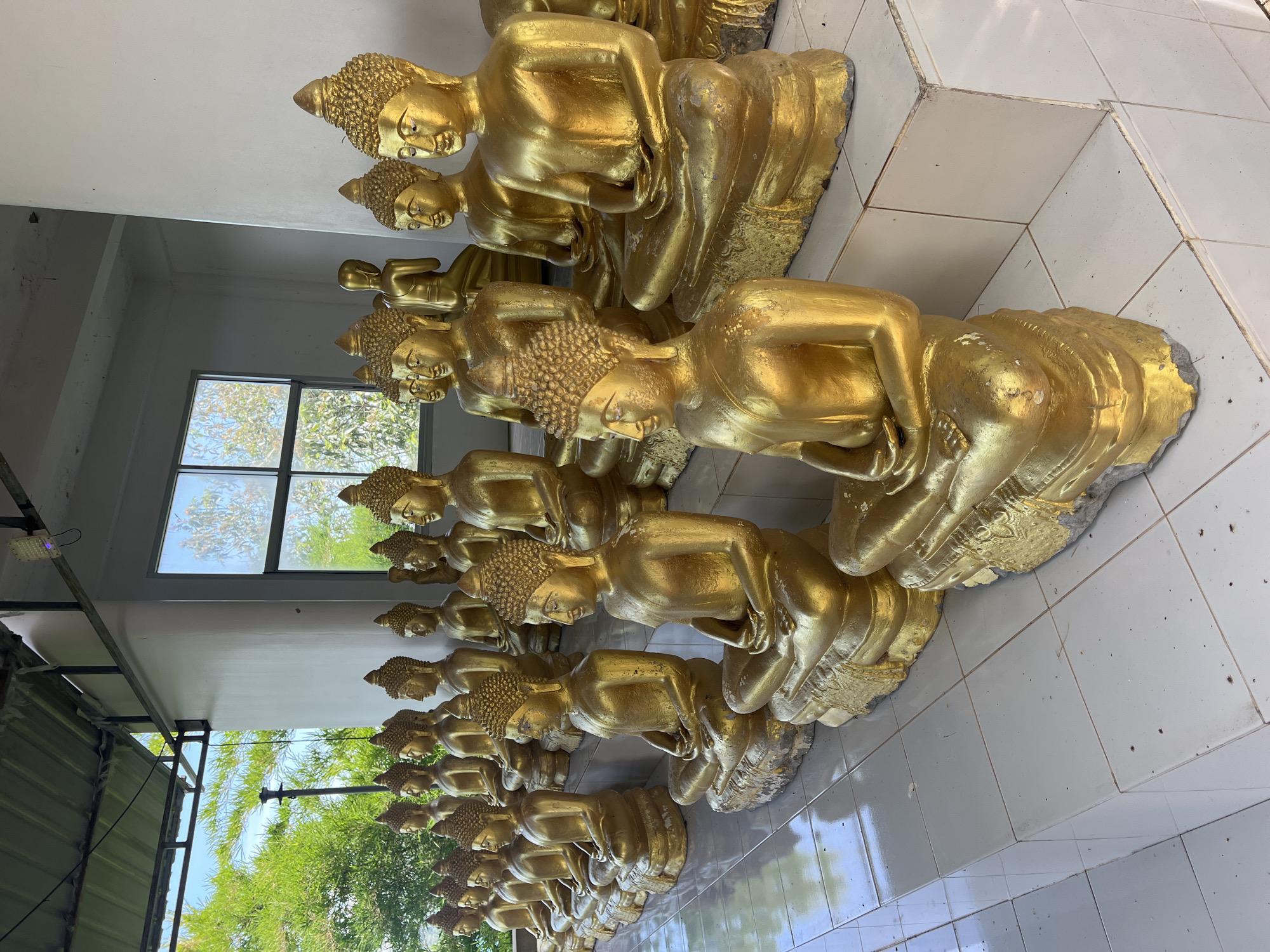 Morning temple visit with Buddha statues in Baan Thong Krut