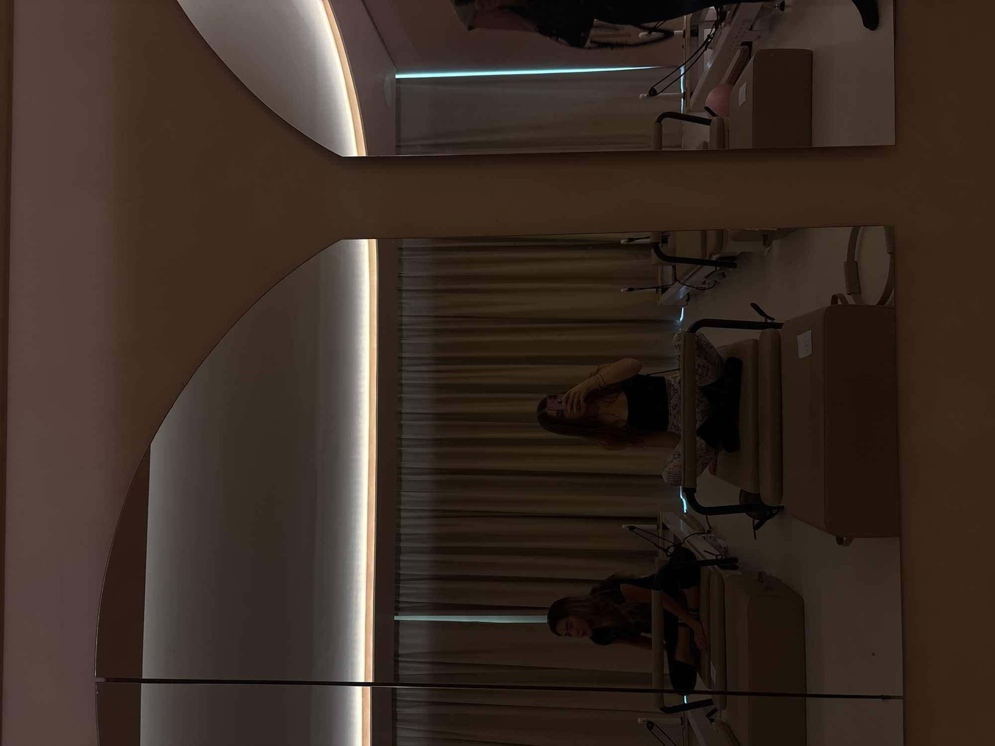 Woman exercises on Pilates reformer in Mexico City studio