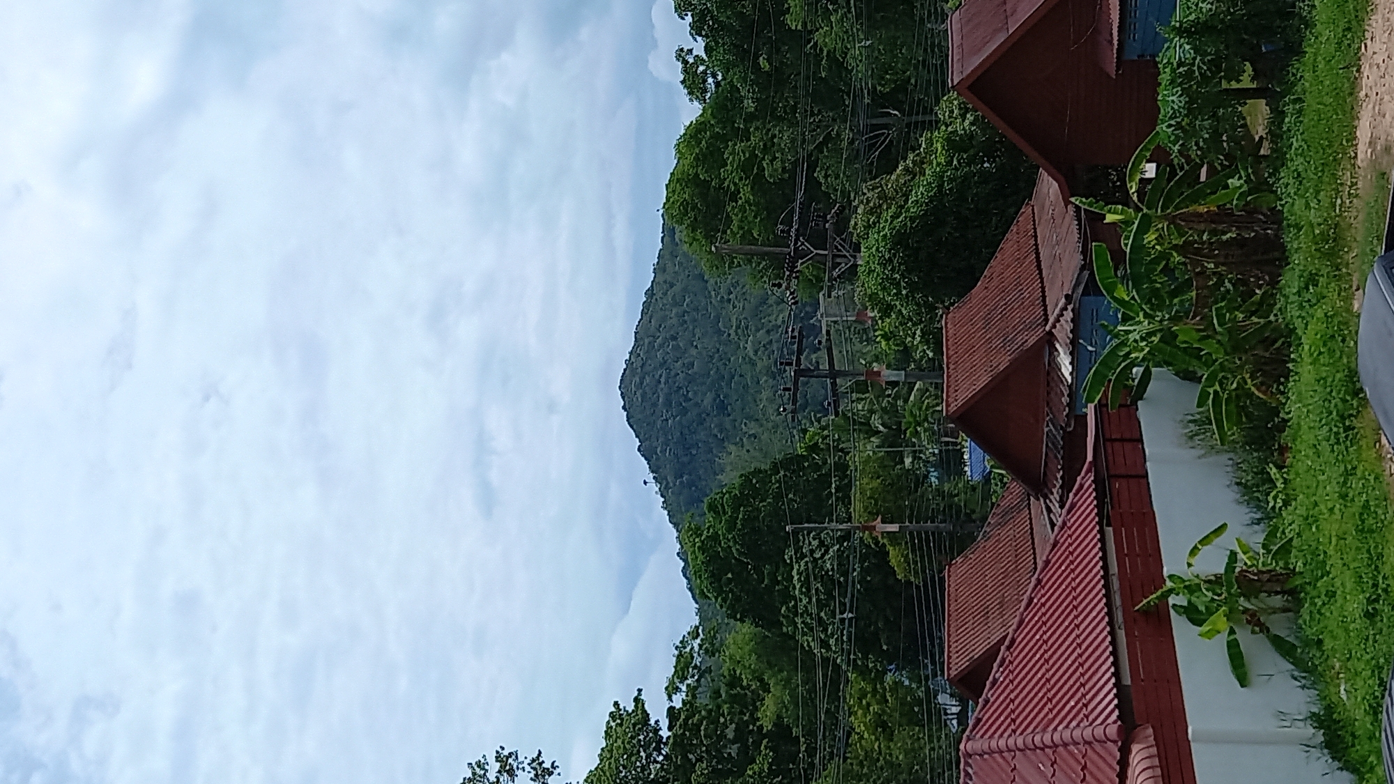 Ko Pha-ngan hillside development: old homes, jungle, and new construction