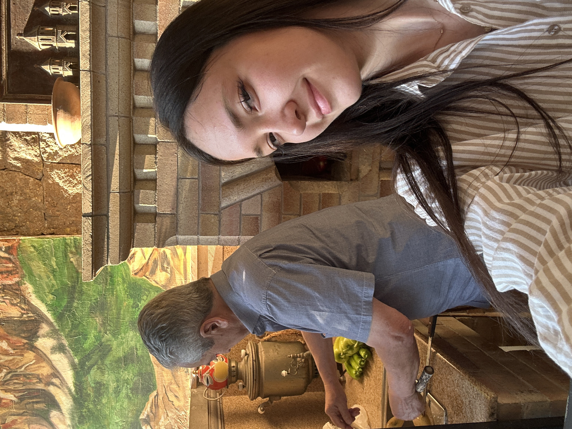Gathering around a brick fireplace at a rustic Yerevan restaurant