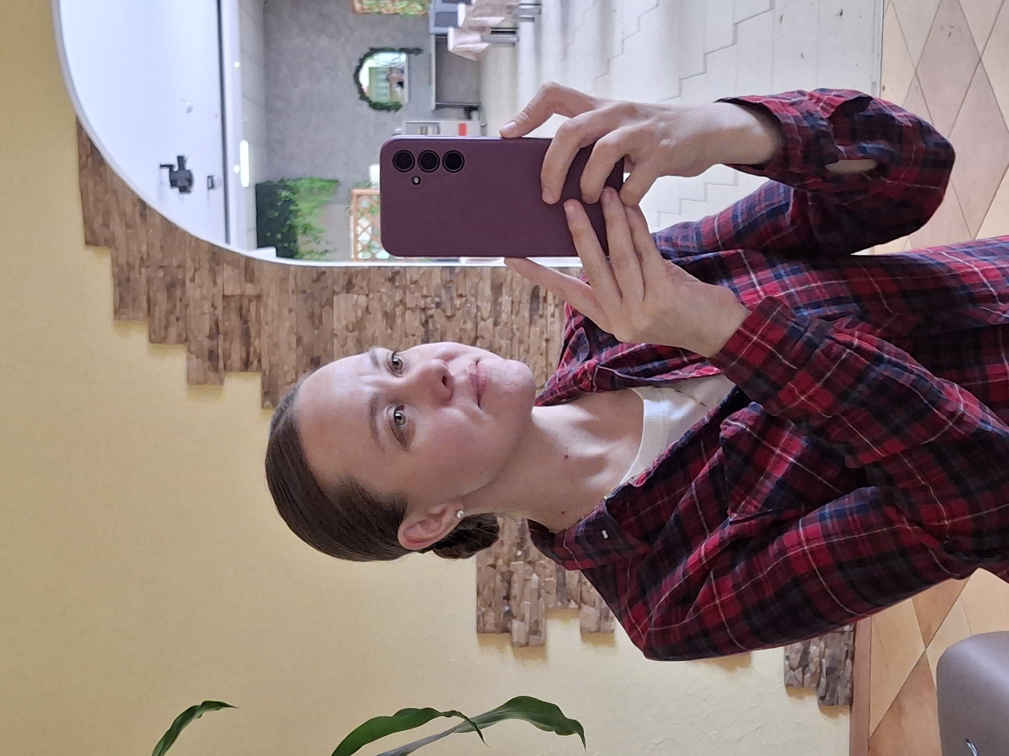 Woman takes selfie with purple phone in Sarapul