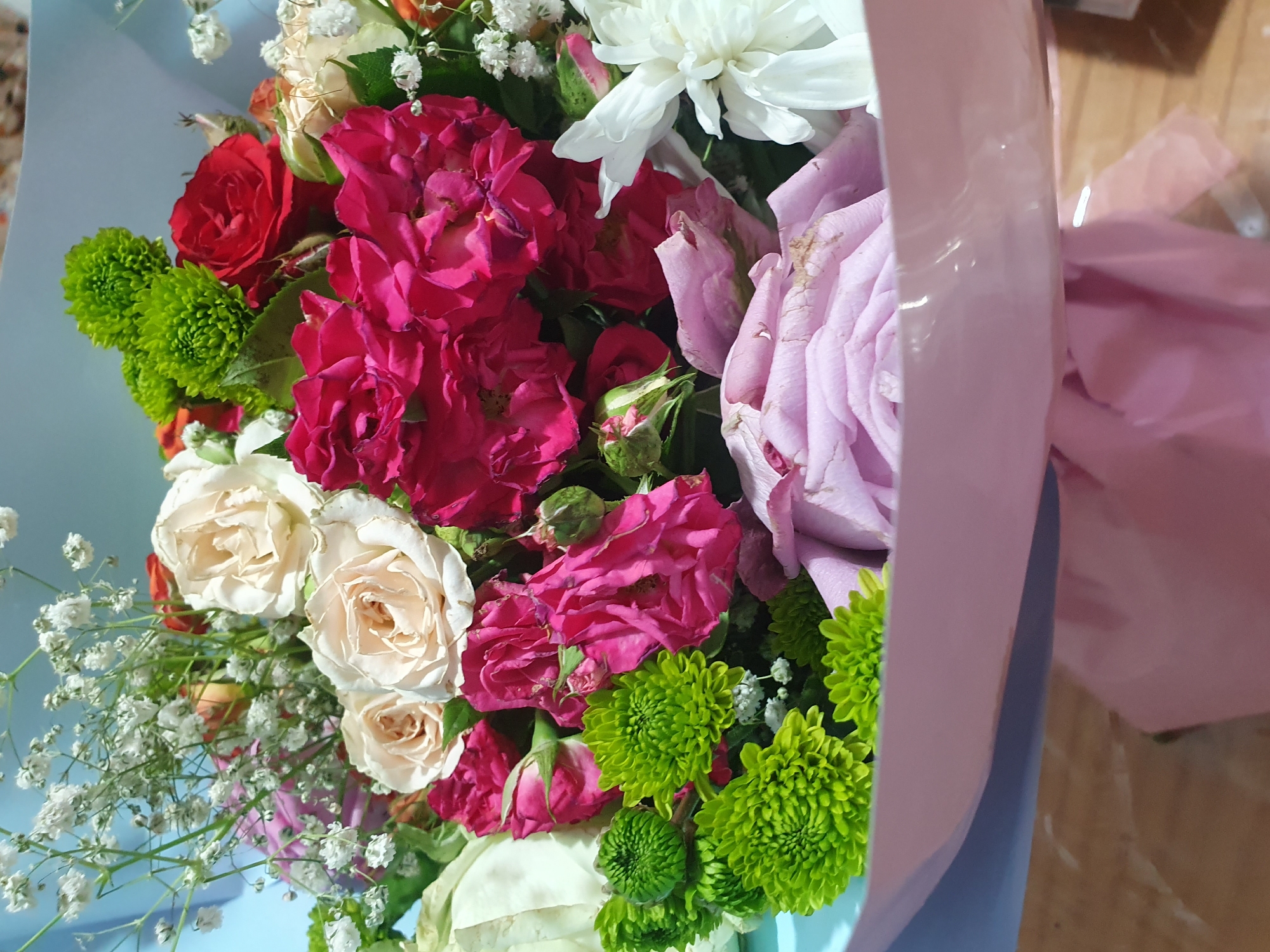 Mixed rose bouquet photographed up close from multiple angles