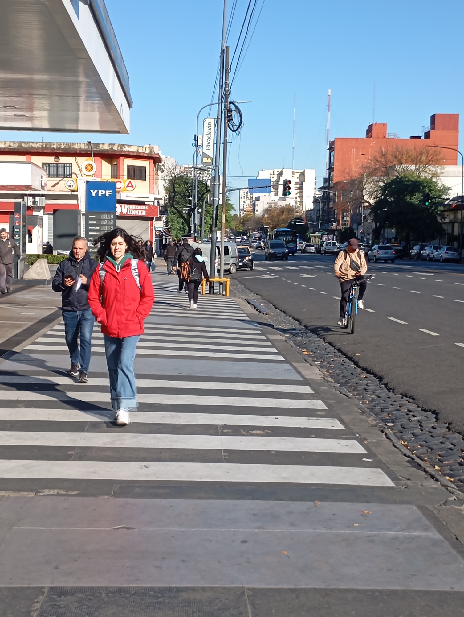 Woman crosses street near Buenos Aires subway station
