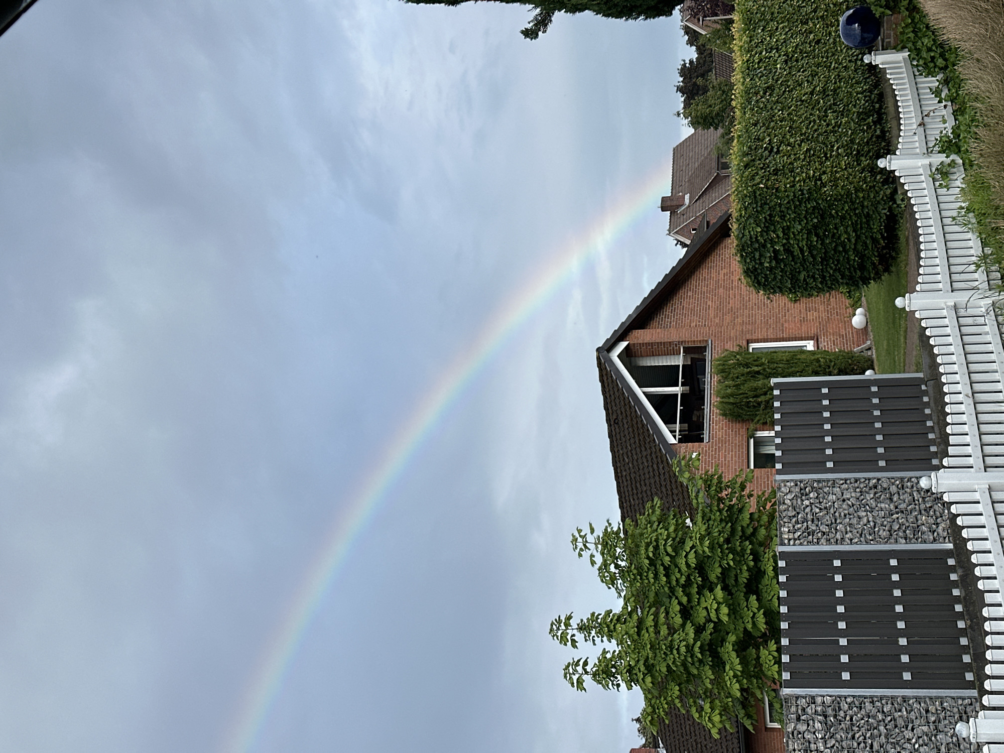 Rainbow appears over Fredenbeck Germany during afternoon storm