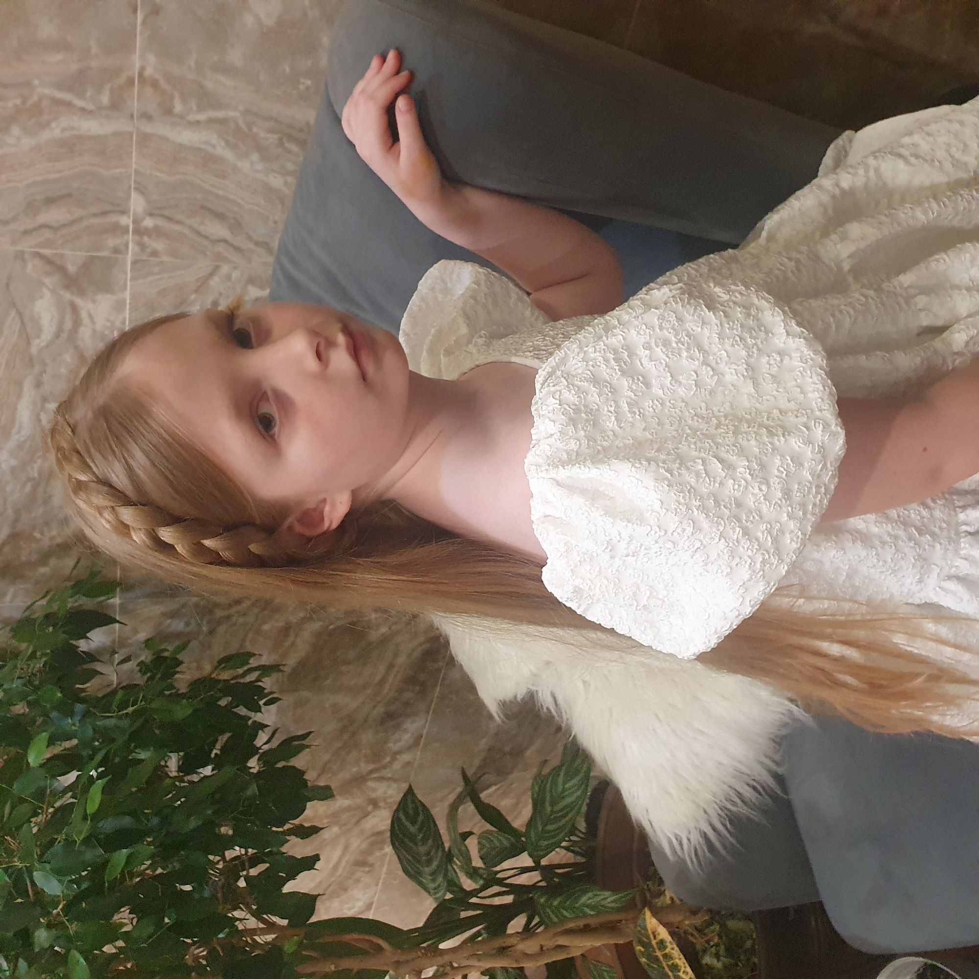 Girl rests on sofa in Chaikovsky, Russia