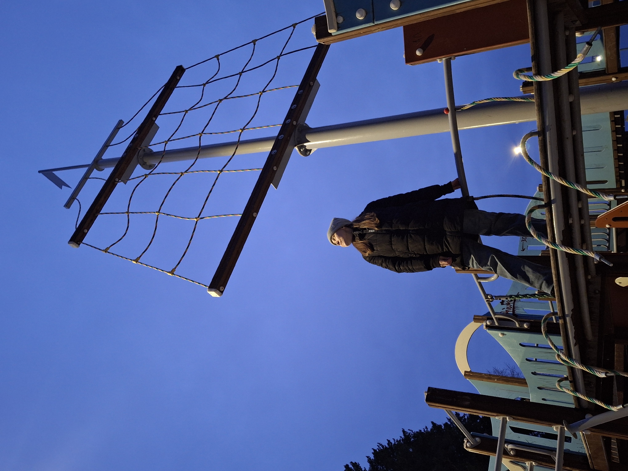 Woman explores ship-themed playground equipment in Chaikovsky, Russia